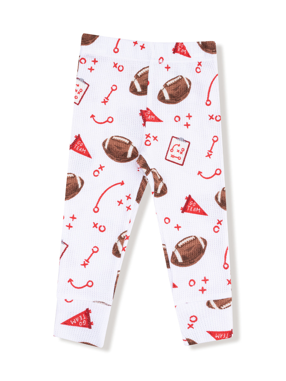 White leggings featuring a playful football print with red accents and game-related symbols.
