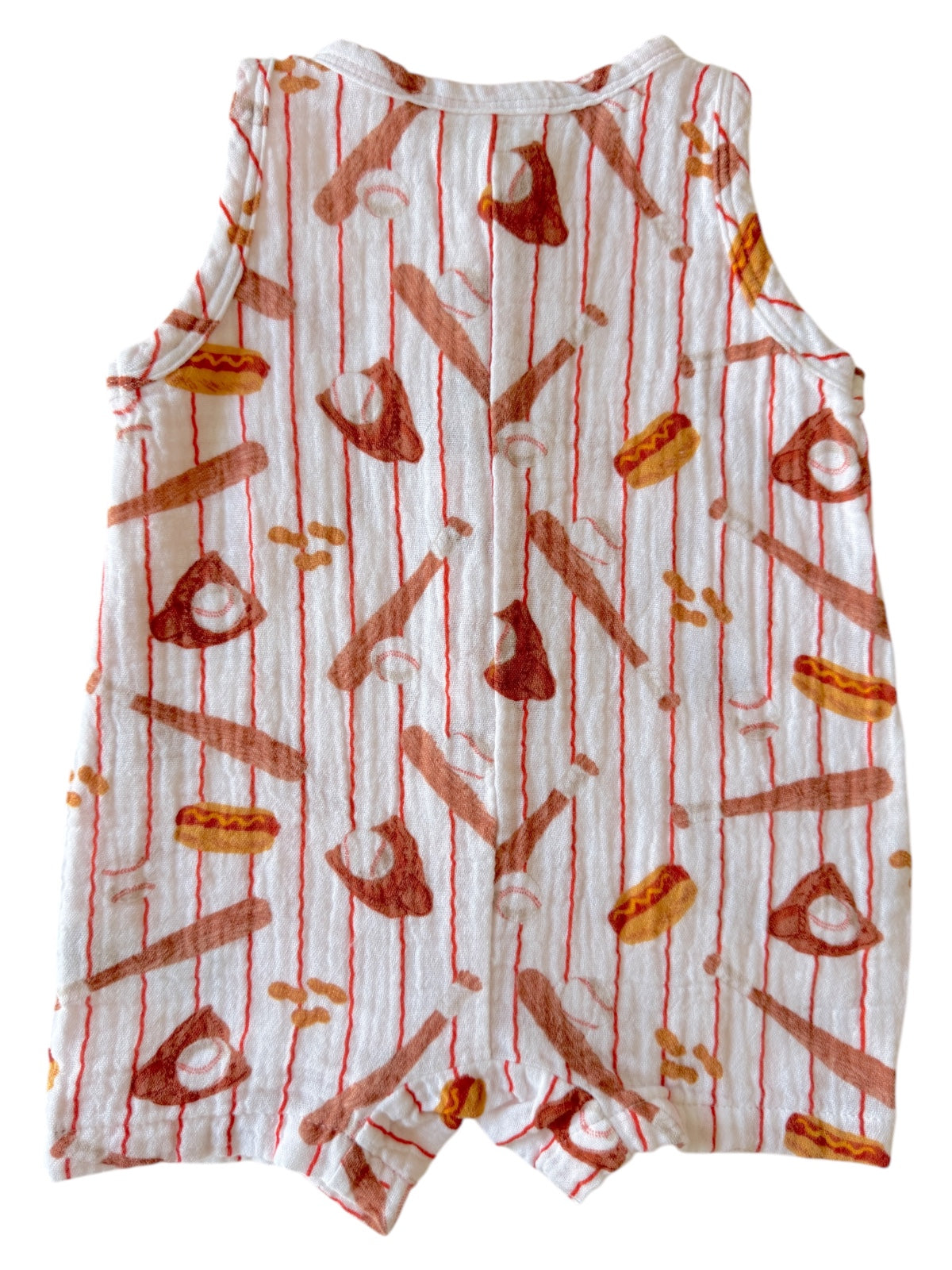 Patterned baby romper featuring food and baseball designs on a light background.