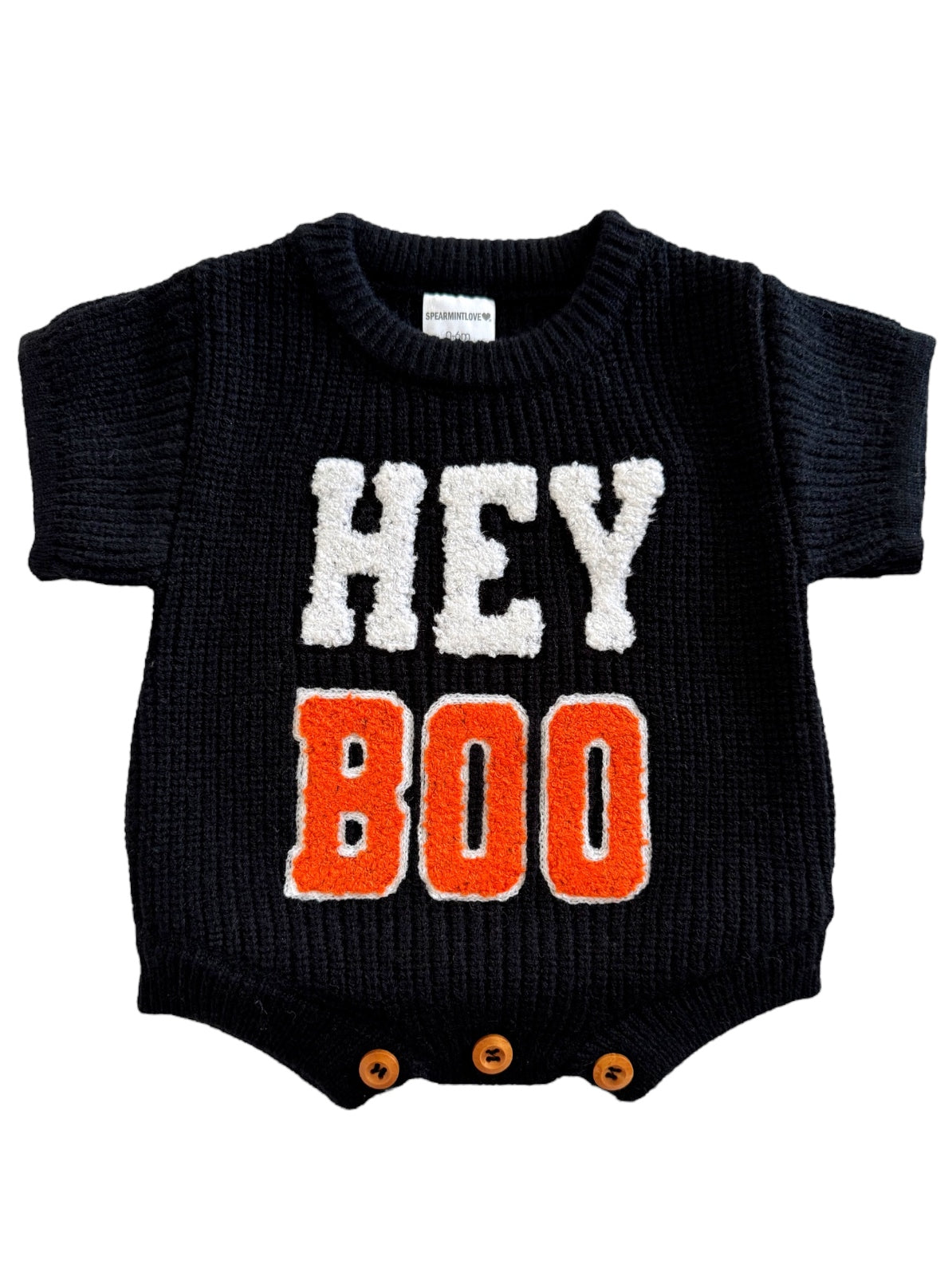 Black baby onesie with "HEY BOO" text in white and orange, featuring short sleeves and bottom snap buttons.