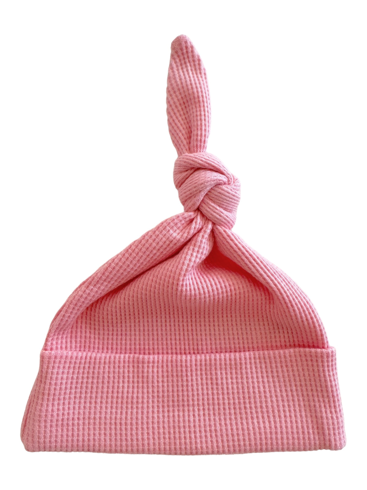 Pink knotted baby hat with a textured pattern, ideal for newborns and infants.