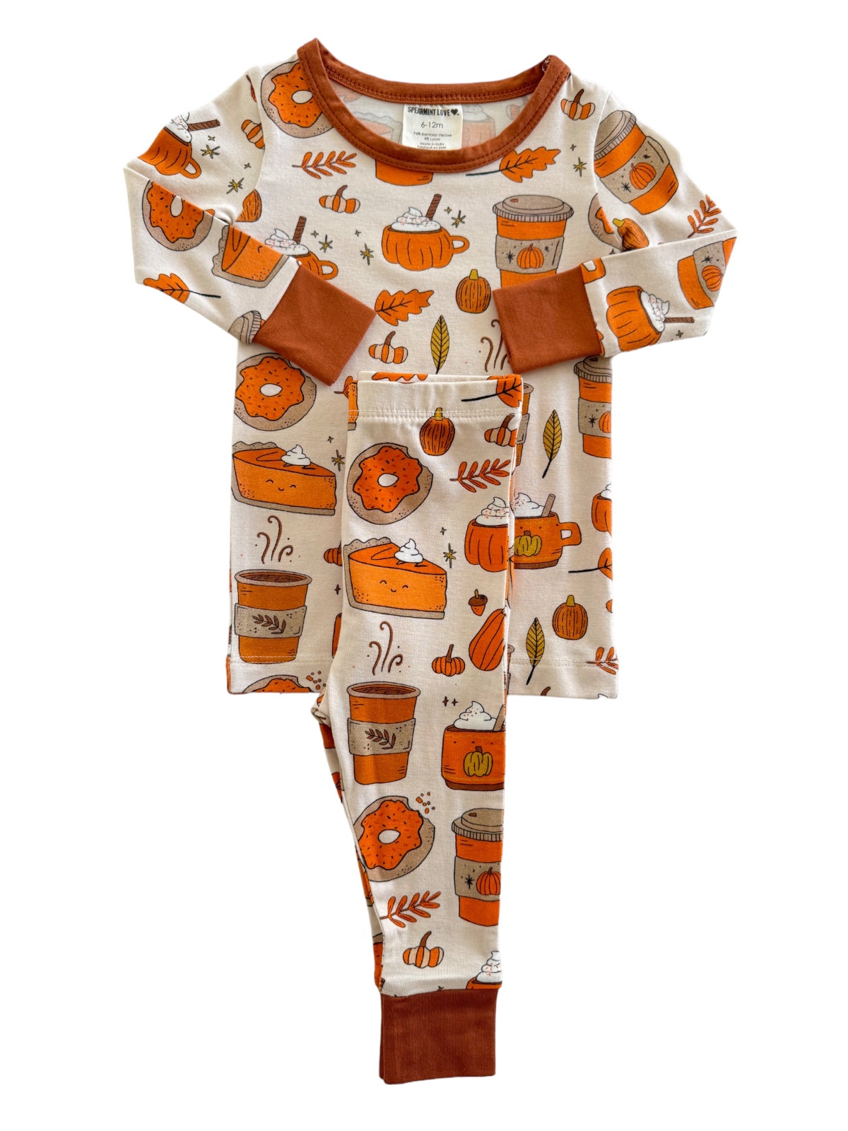 Toddler pajamas featuring a playful autumn design with pumpkins, donuts, and cozy drink illustrations.