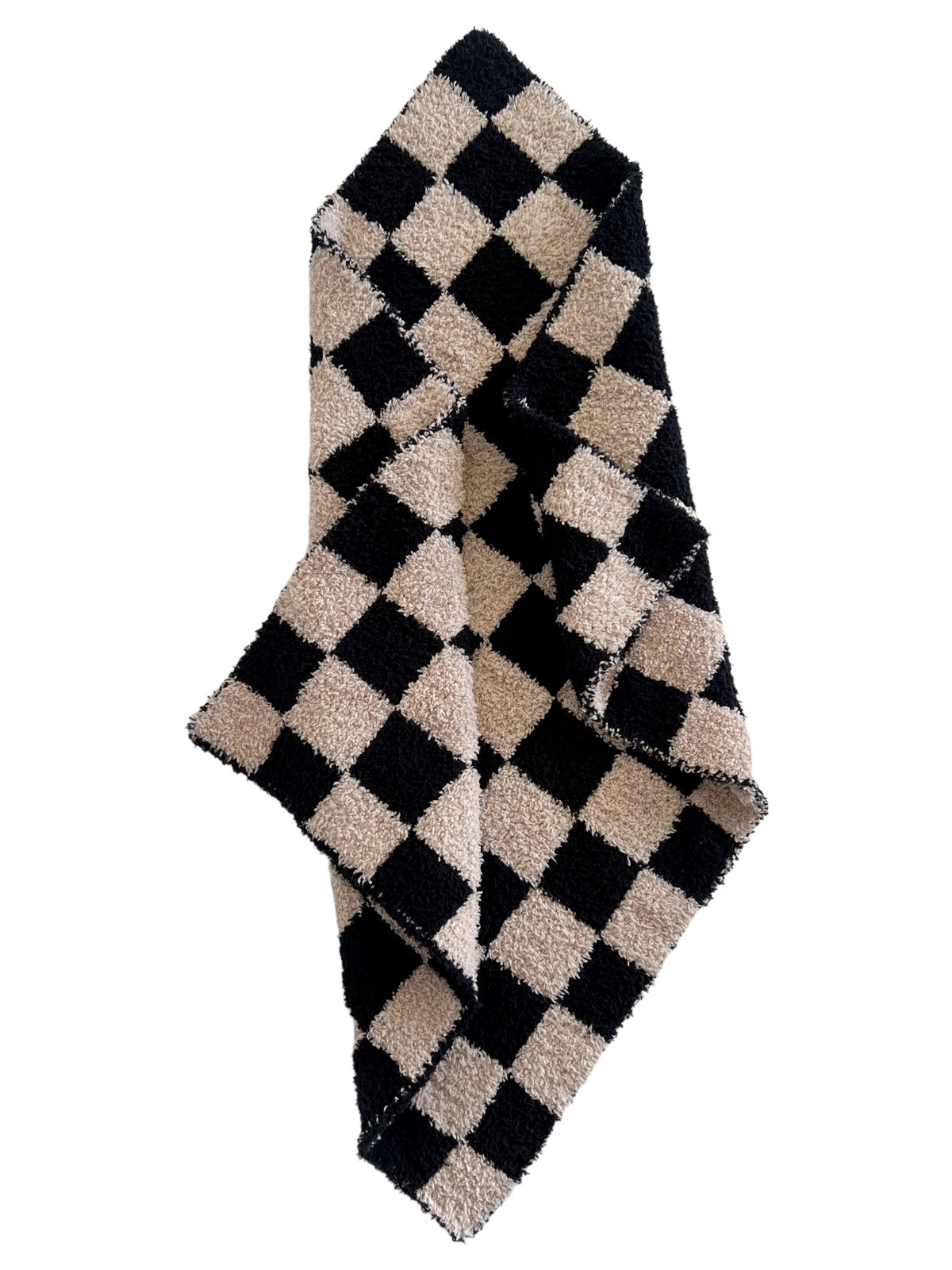 Black and beige checkered towel draped elegantly, featuring a plush texture and bold pattern.