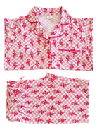Pink and white checkered pajamas with candy cane and bow patterns, laid flat for display.