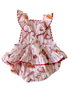 White baby romper with red food print and frill details, perfect for warm weather.