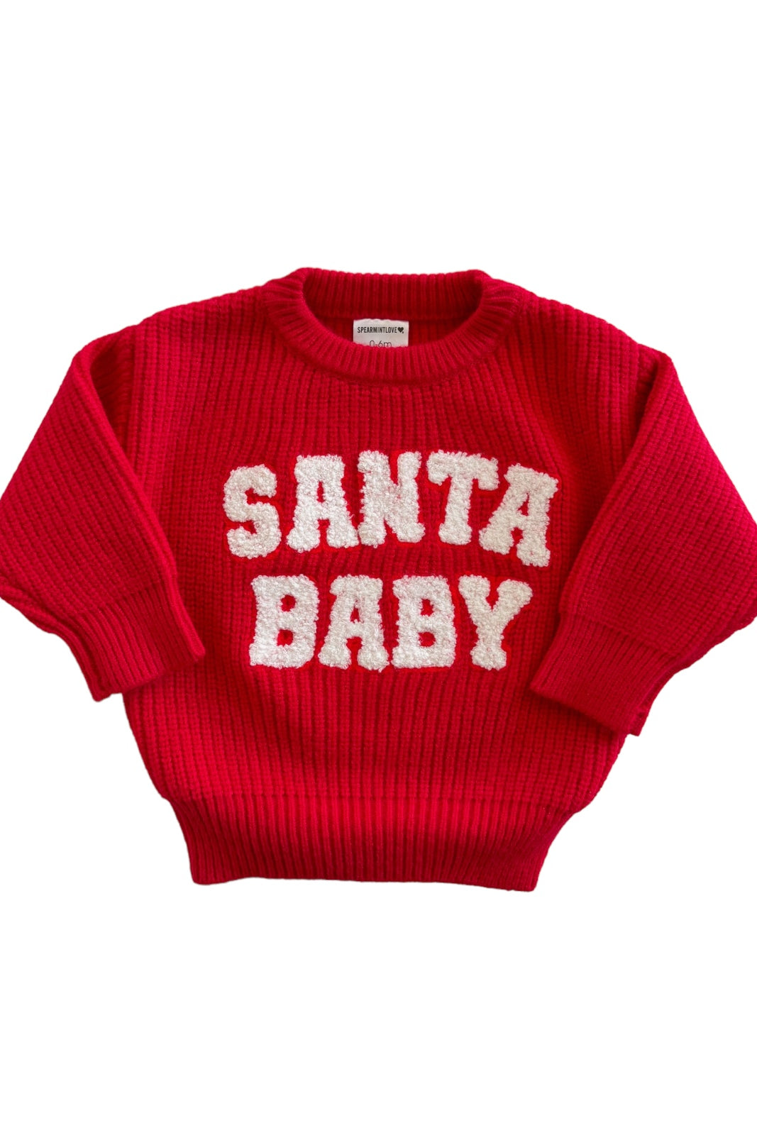 Red knitted sweater with "SANTA BABY" in fluffy white letters displayed prominently on the front.