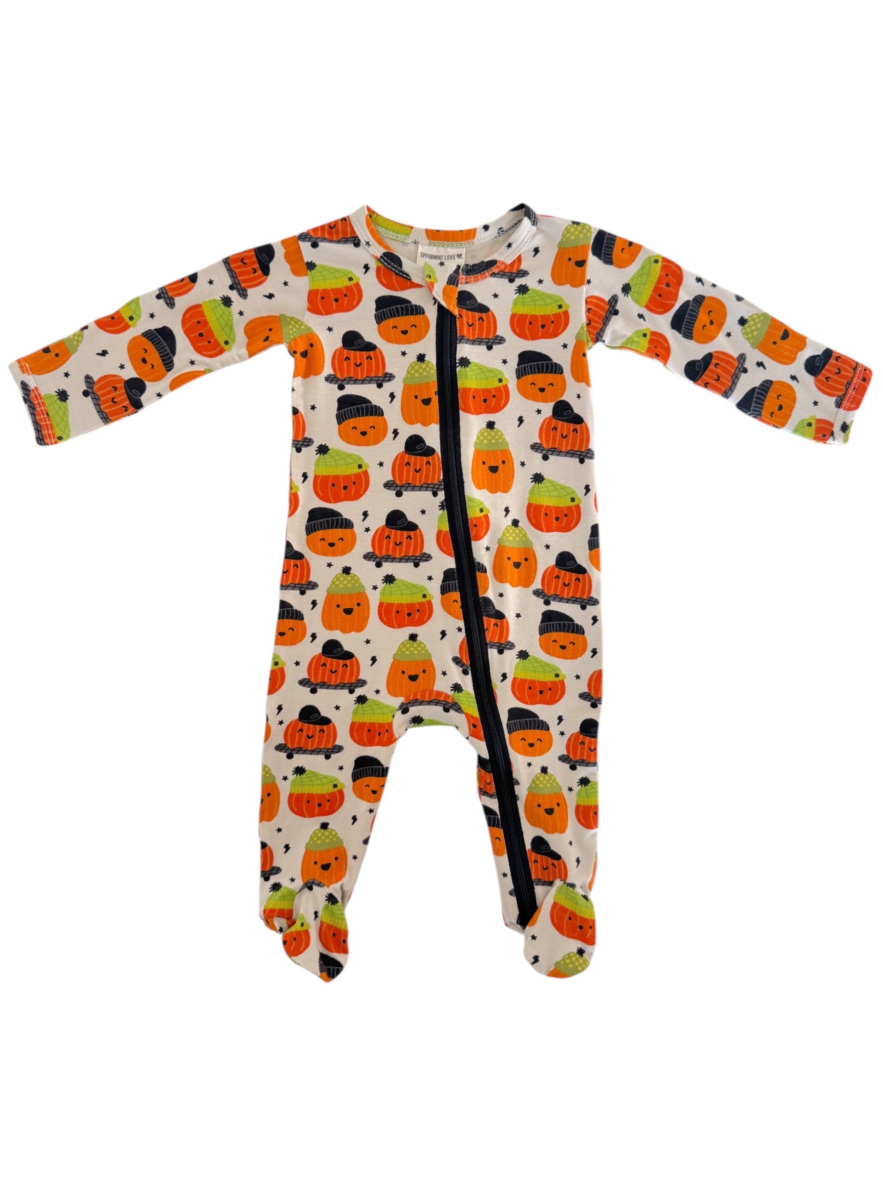 Baby onesie with colorful pumpkin and candy corn design, featuring a front zipper and footed legs.