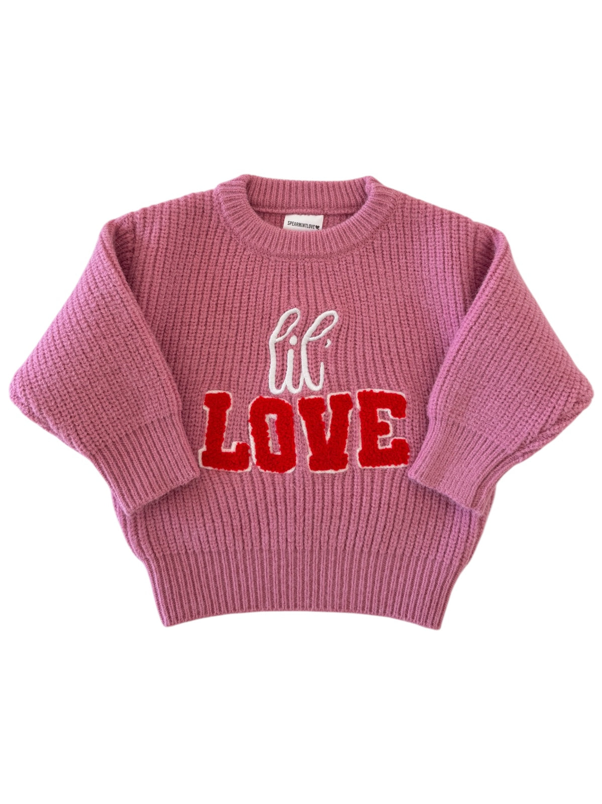 Pink knitted sweater featuring the word "lil LOVE" in red and white letters. Perfect for cozy, stylish wear.