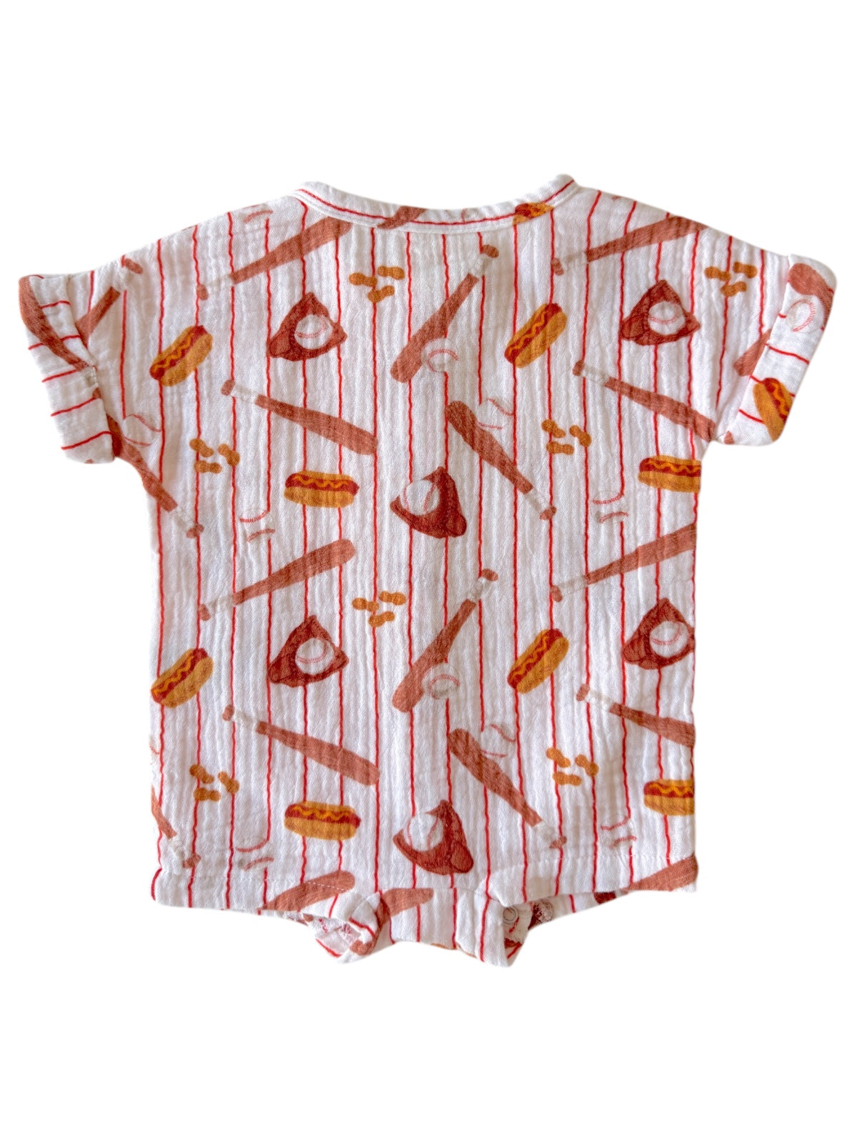 Children's short-sleeve onesie with playful food and utensils pattern on a white background.