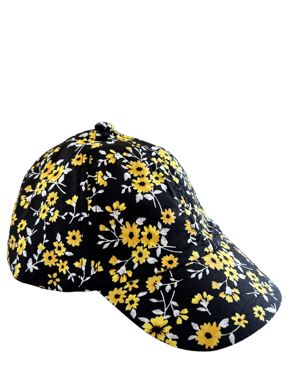 Black cap with a vibrant yellow floral pattern, featuring small white flowers and a curved brim.