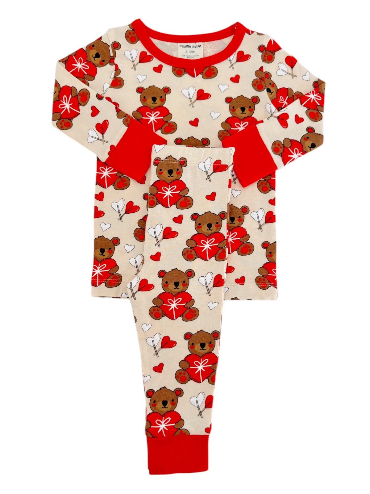 Children's pajamas featuring teddy bears, hearts, and arrows in red and beige. Cute and cozy for sleepwear.