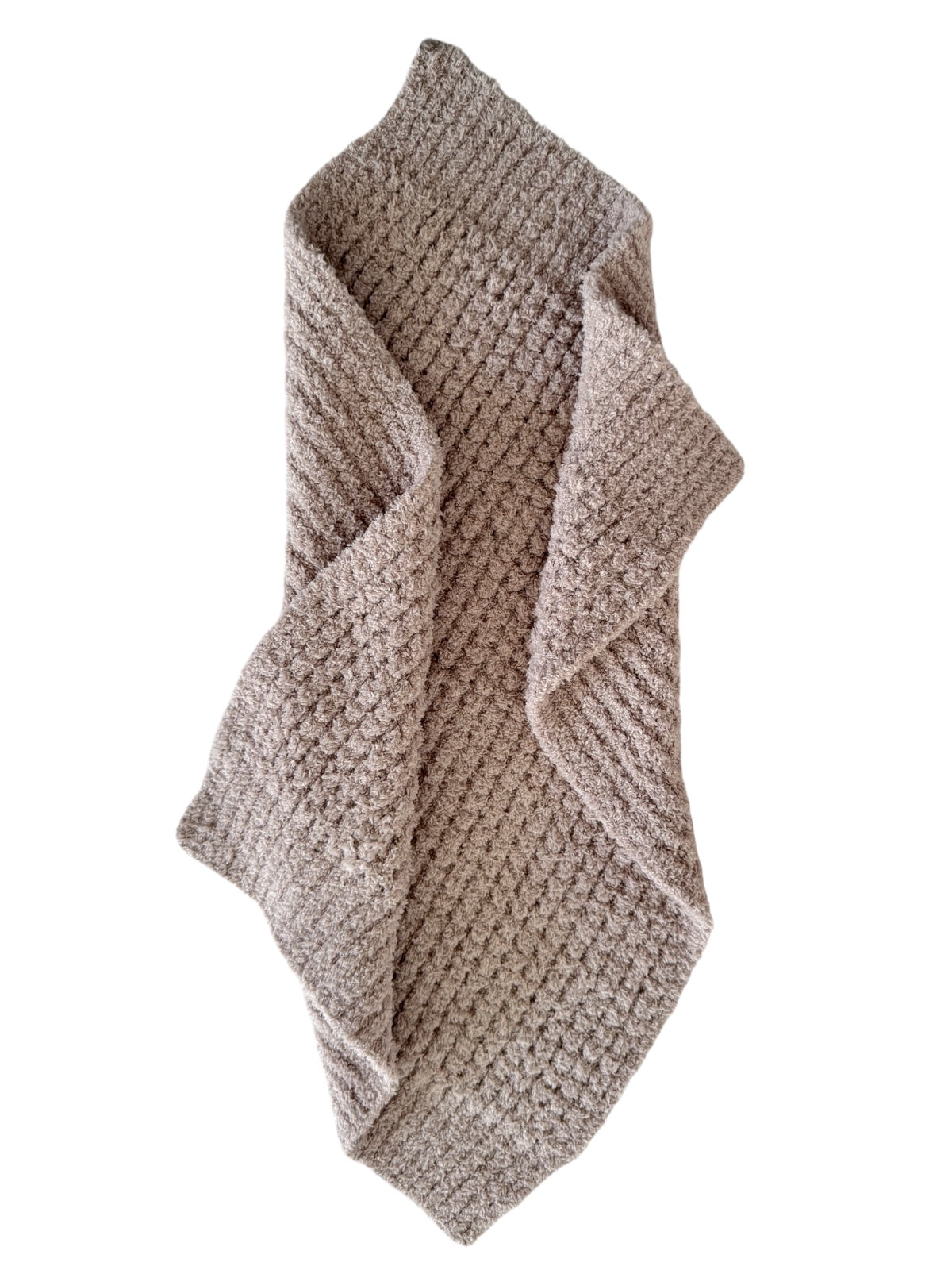Cozy textured blanket in a beige color, folded and displayed on a white background.