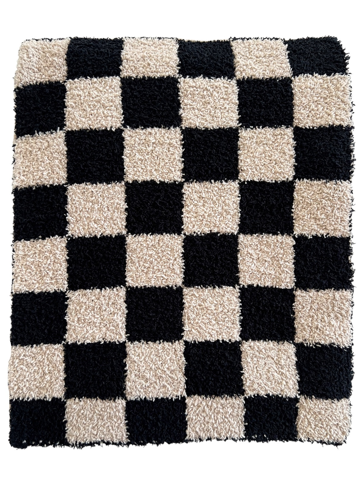 Black and beige shaggy rug with a large checkerboard pattern.