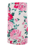 Floral patterned fabric featuring pink roses and green leaves on a light background.