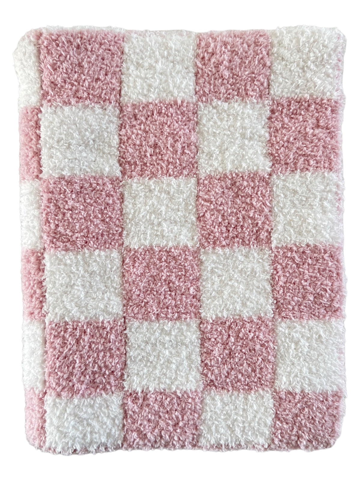 Pink and white checkered fluffy rug, featuring a soft texture and a bold pattern.