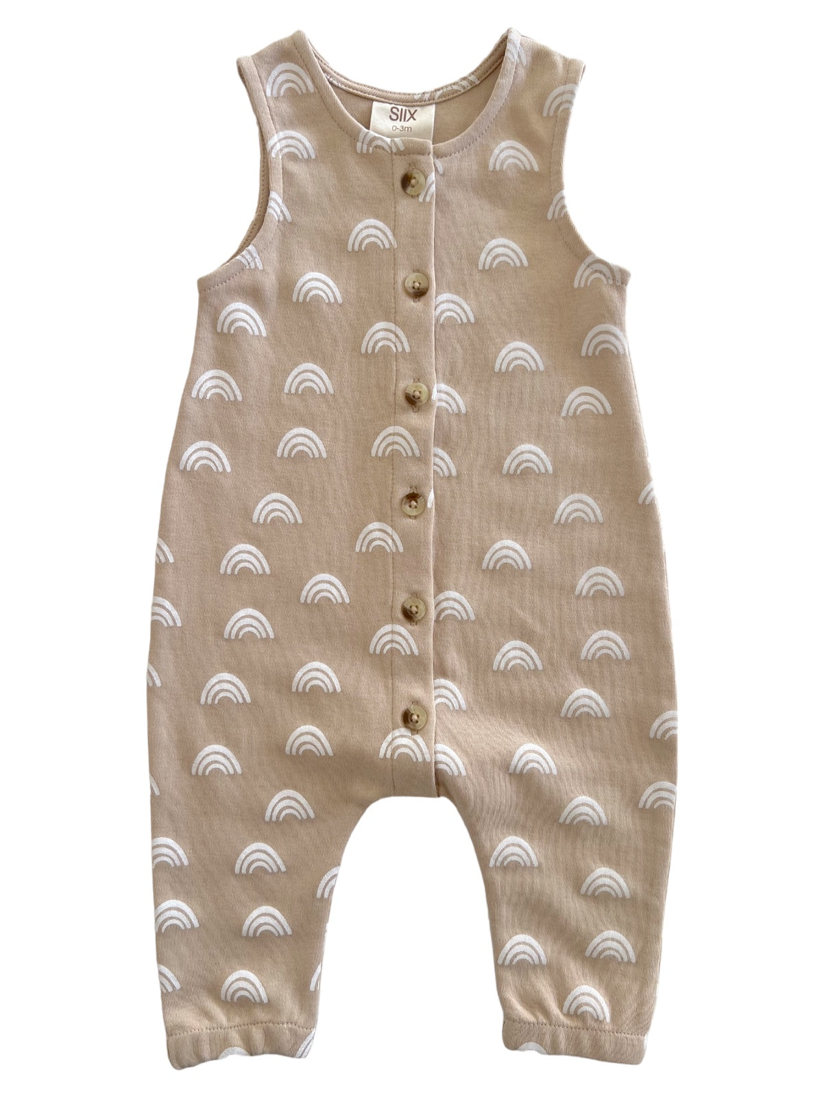 Beige baby romper with white rainbow pattern and buttons down the front. Ideal for toddler outfits.