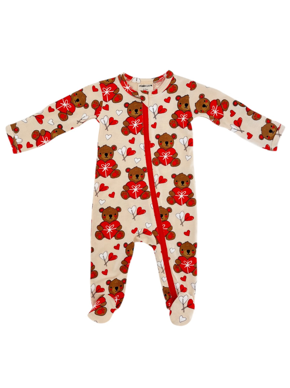 Cream onesie with teddy bears and hearts, featuring long sleeves and a front zipper. Ideal for infants.