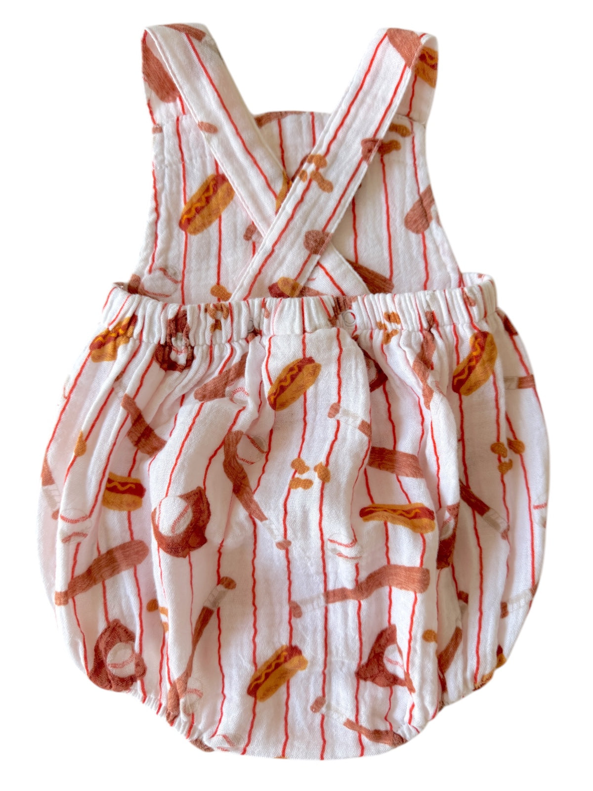 Child's overall romper with hot dog print, featuring crisscross straps and an elastic waist.