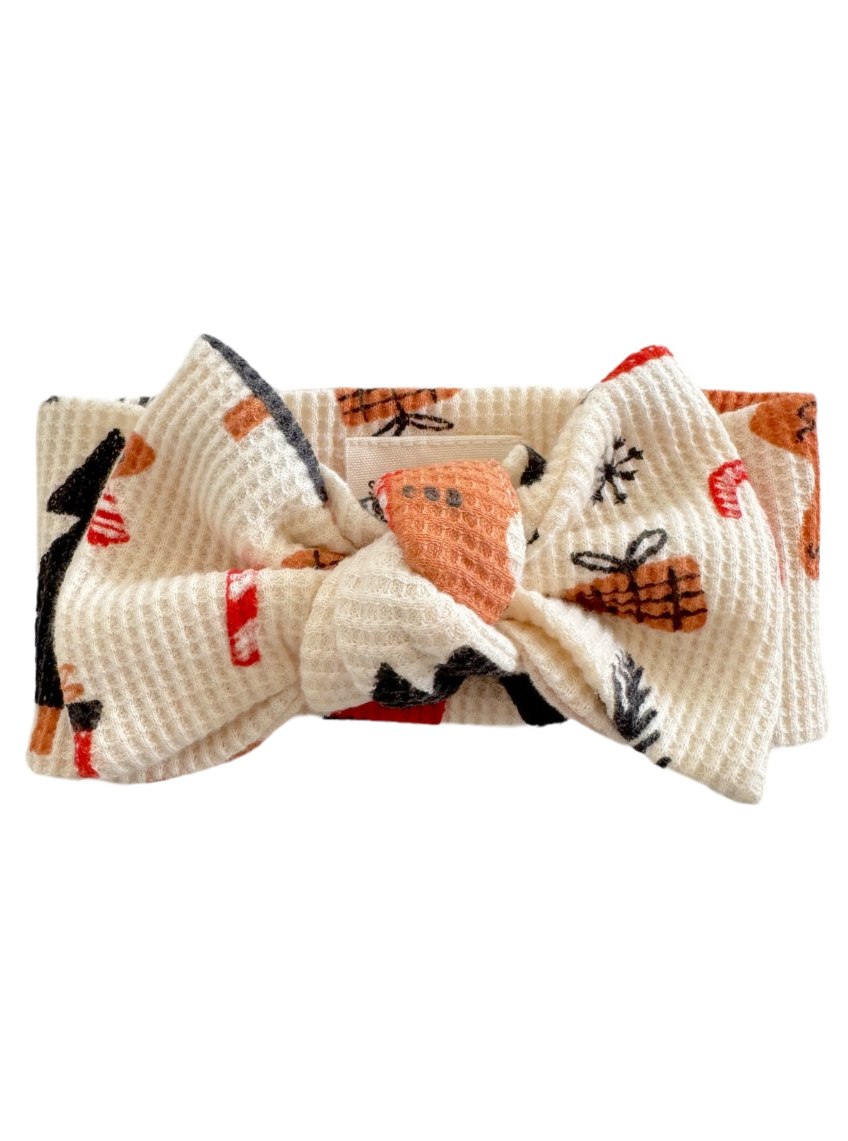 Light cream headband with a large bow and colorful patterned designs.