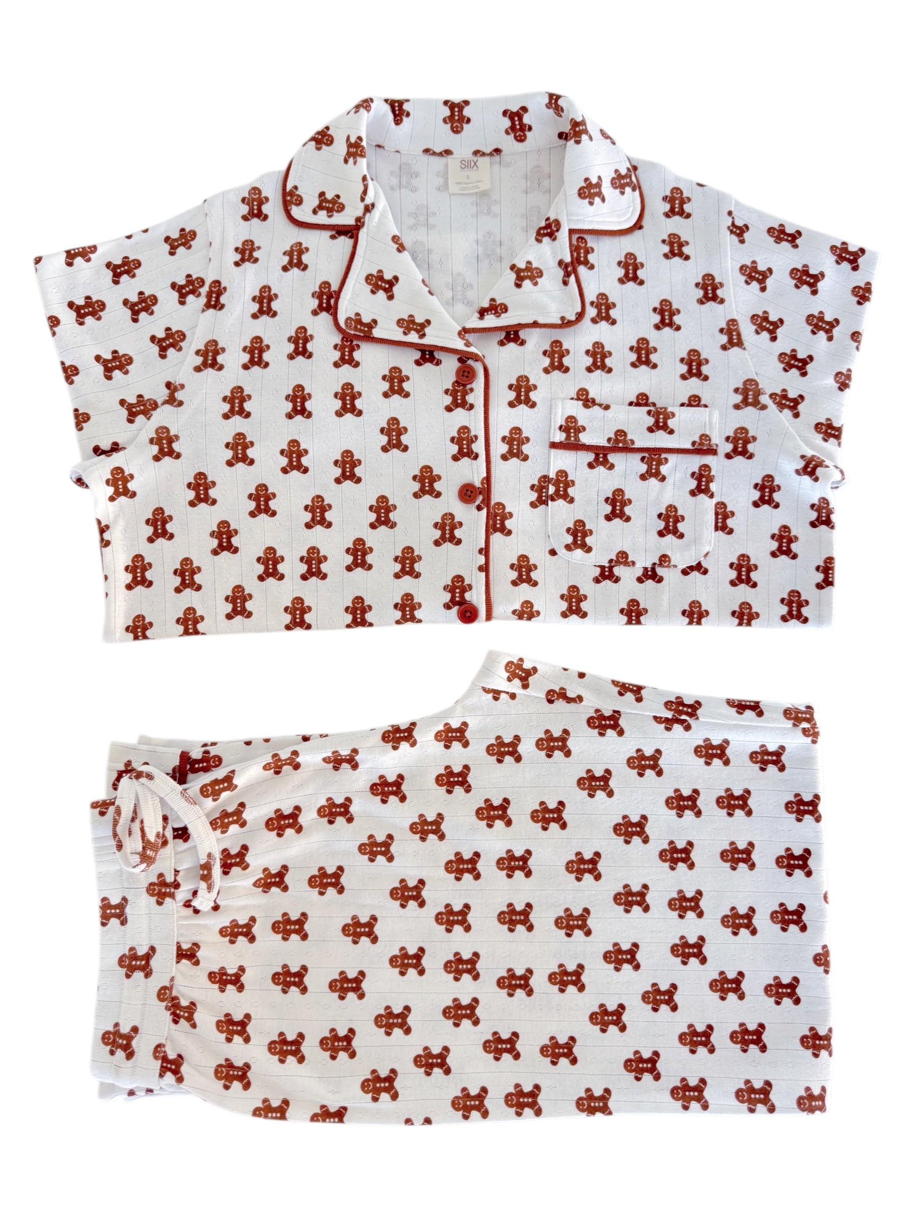 Gingerbread-themed women's pajamas set with short sleeves and pants on a white background.