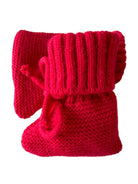Red knitted baby booties with a ribbed top and ties for securing, sitting side by side.