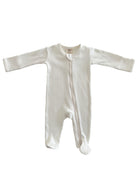 White ribbed infant onesie with long sleeves and zipper closure.