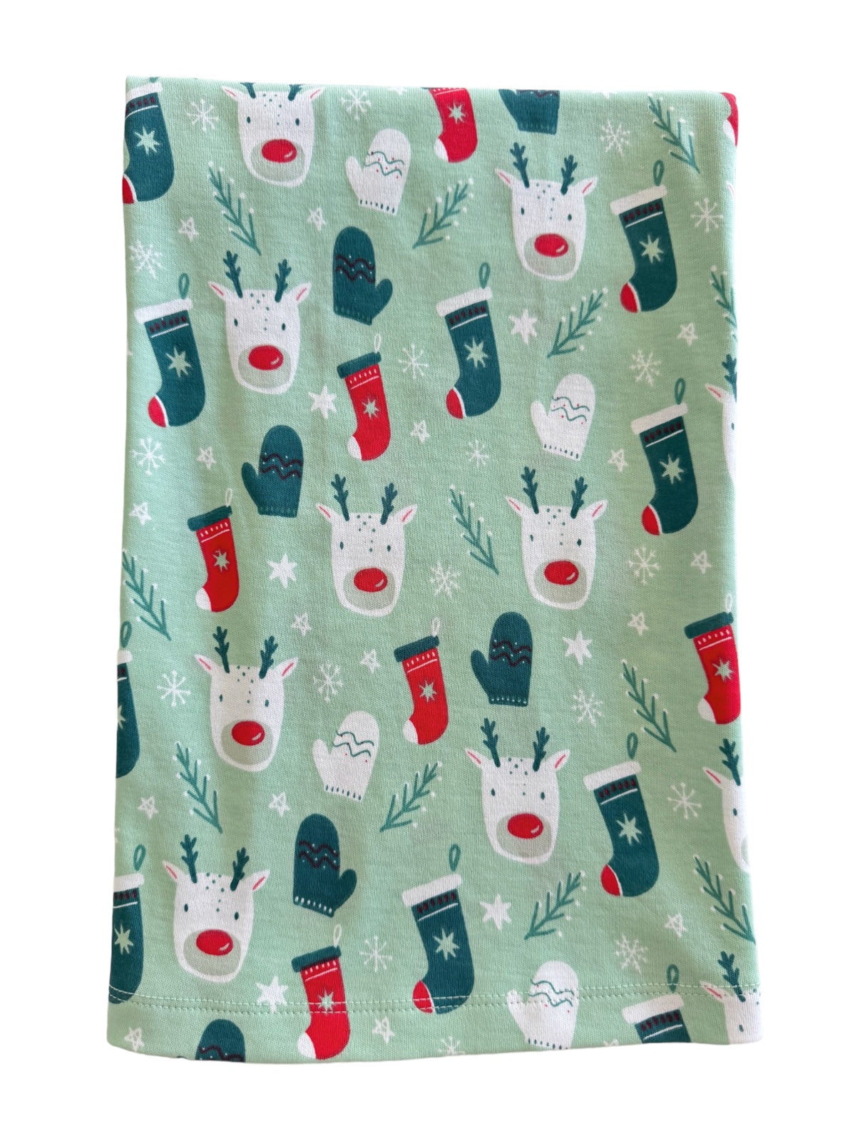 Festive fabric featuring reindeer, mittens, and stockings on a light green background with snowflakes.