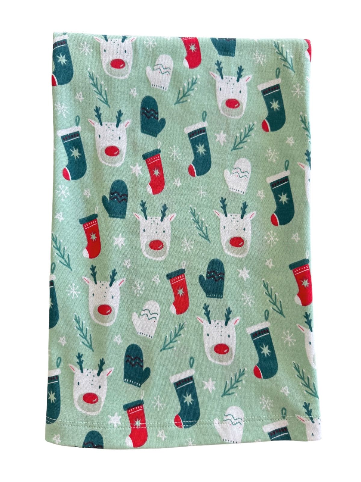 Festive fabric featuring reindeer, mittens, and stockings on a light green background with snowflakes.