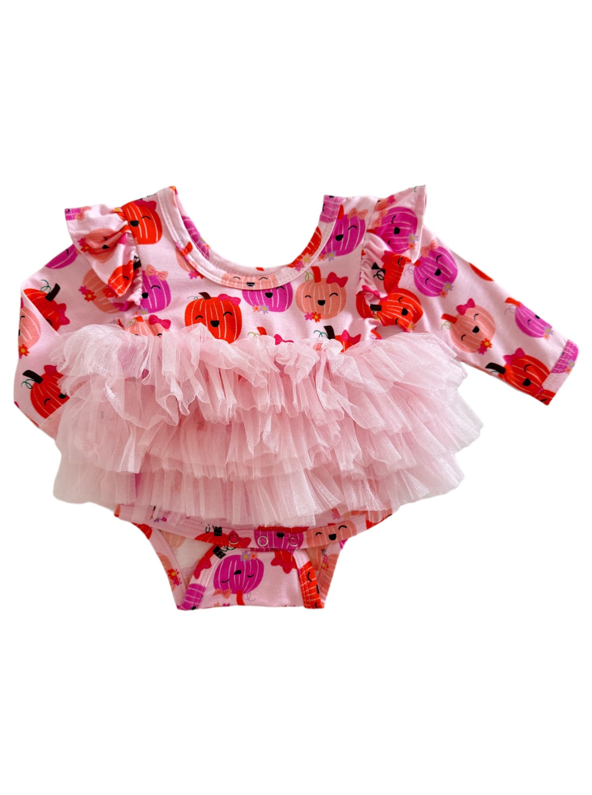 Pink onesie with pumpkin print and a fluffy tulle ruffle skirt for infants. Perfect for fall-themed outfits.