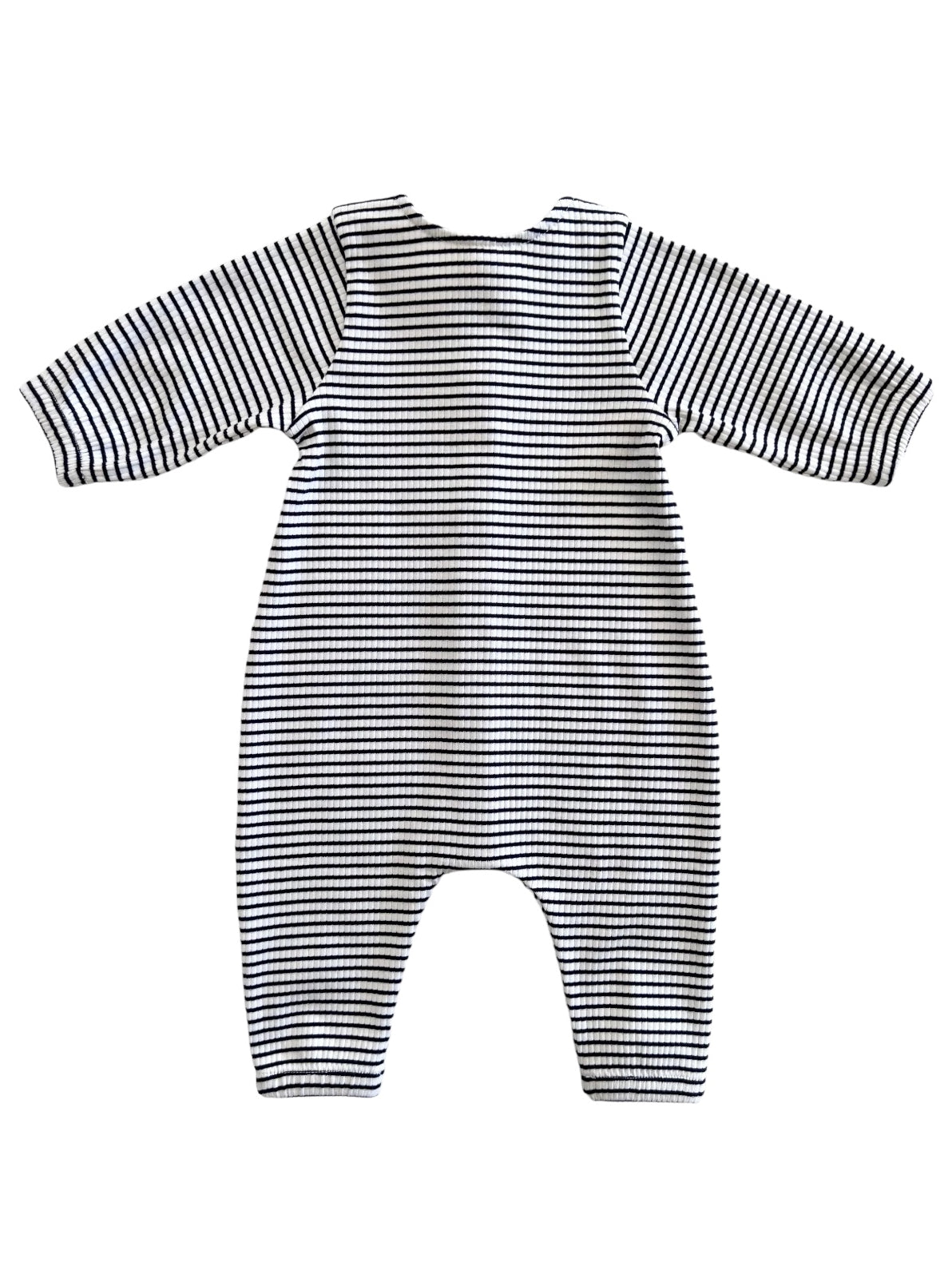 Striped baby romper in black and white, featuring long sleeves and a relaxed fit, viewed from the back.