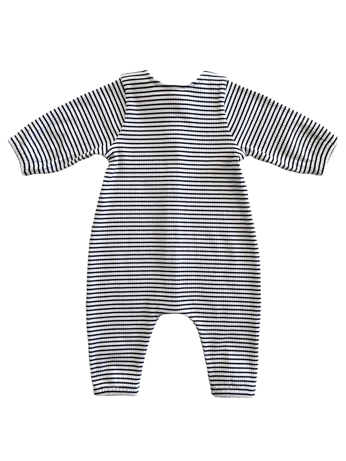 Striped baby romper in black and white, featuring long sleeves and a relaxed fit, viewed from the back.