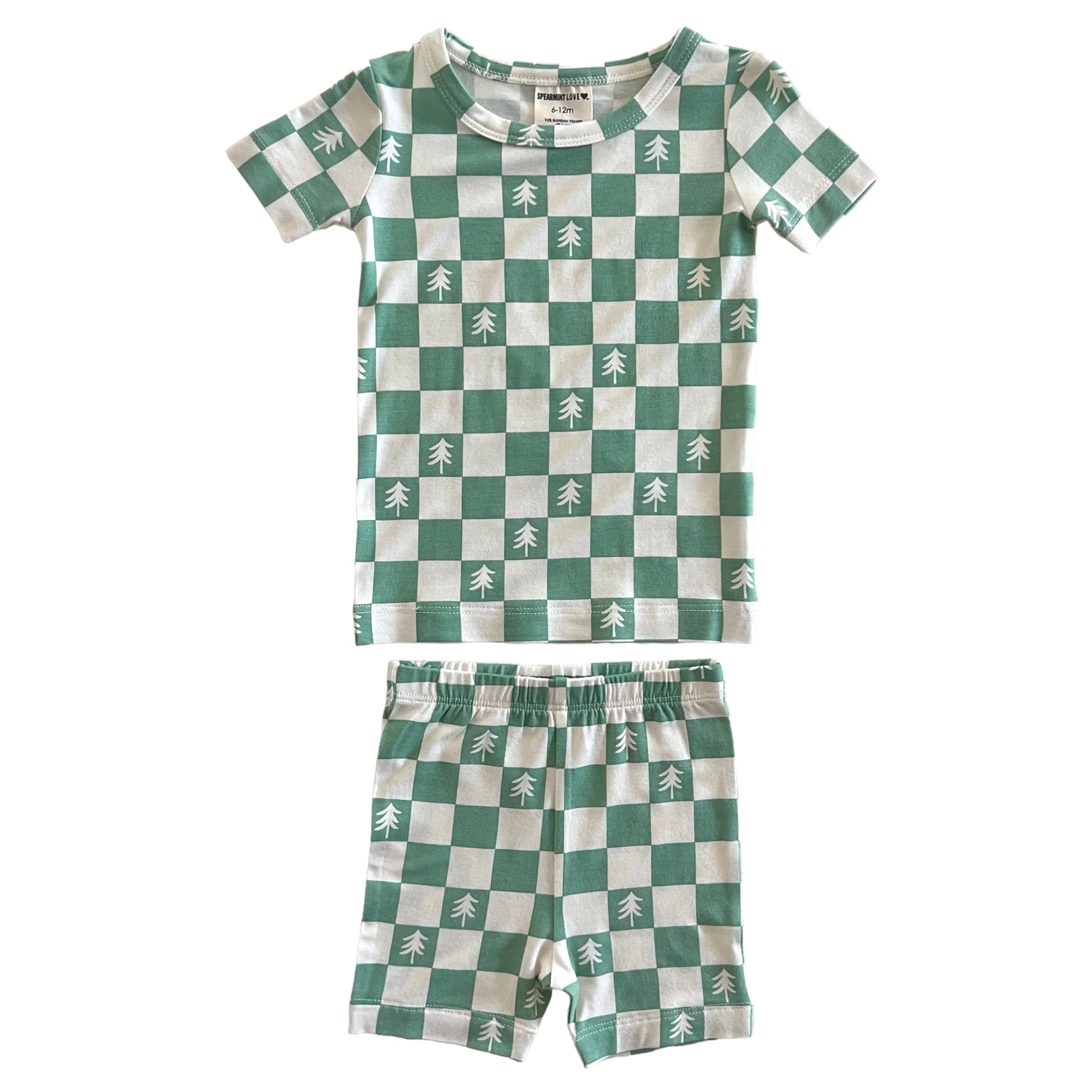Green and white checkered children's pajamas with tree patterns on top and shorts.