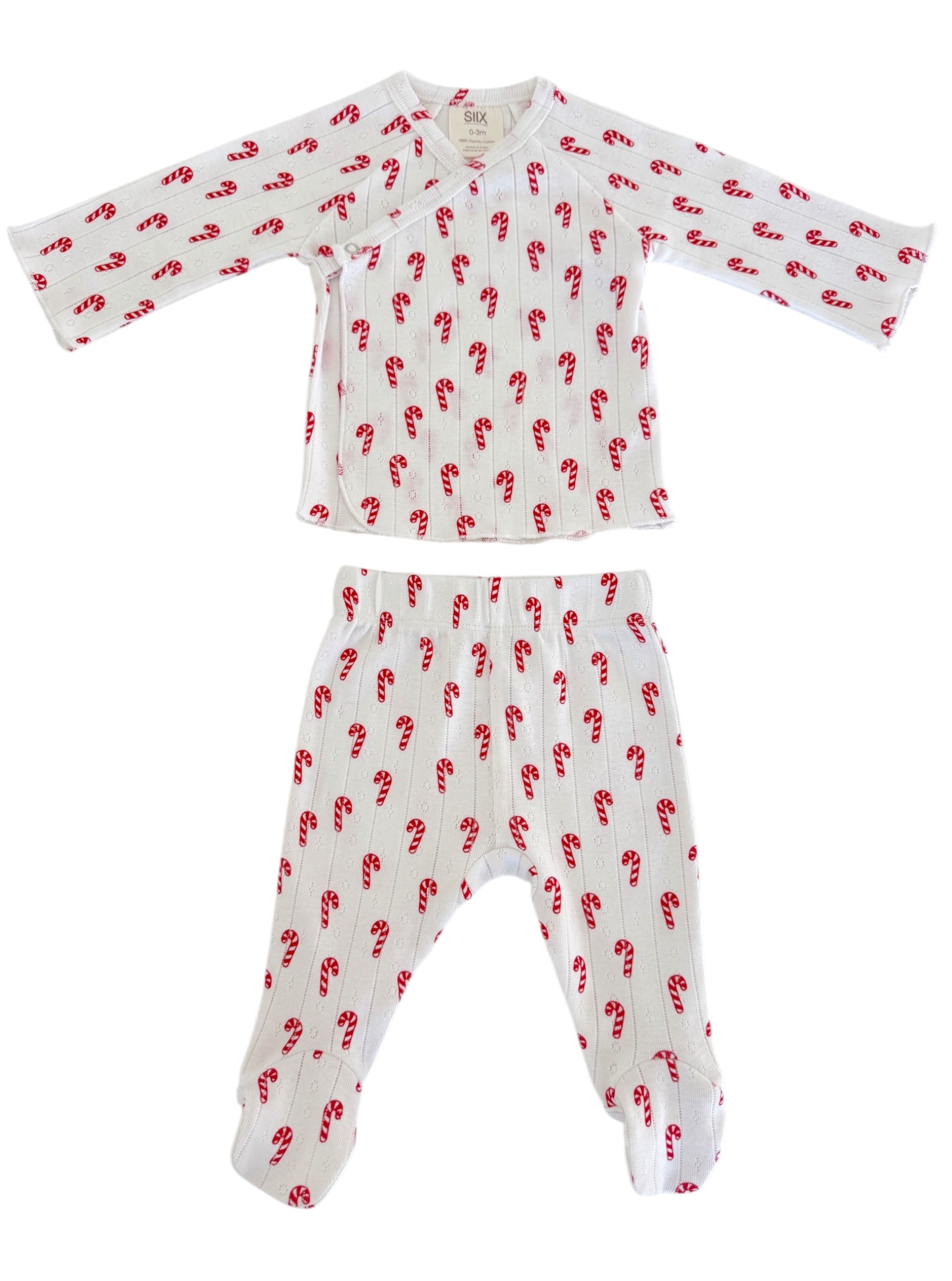 Red candy cane patterned baby pajamas set with long sleeves and footed pants on a white background.