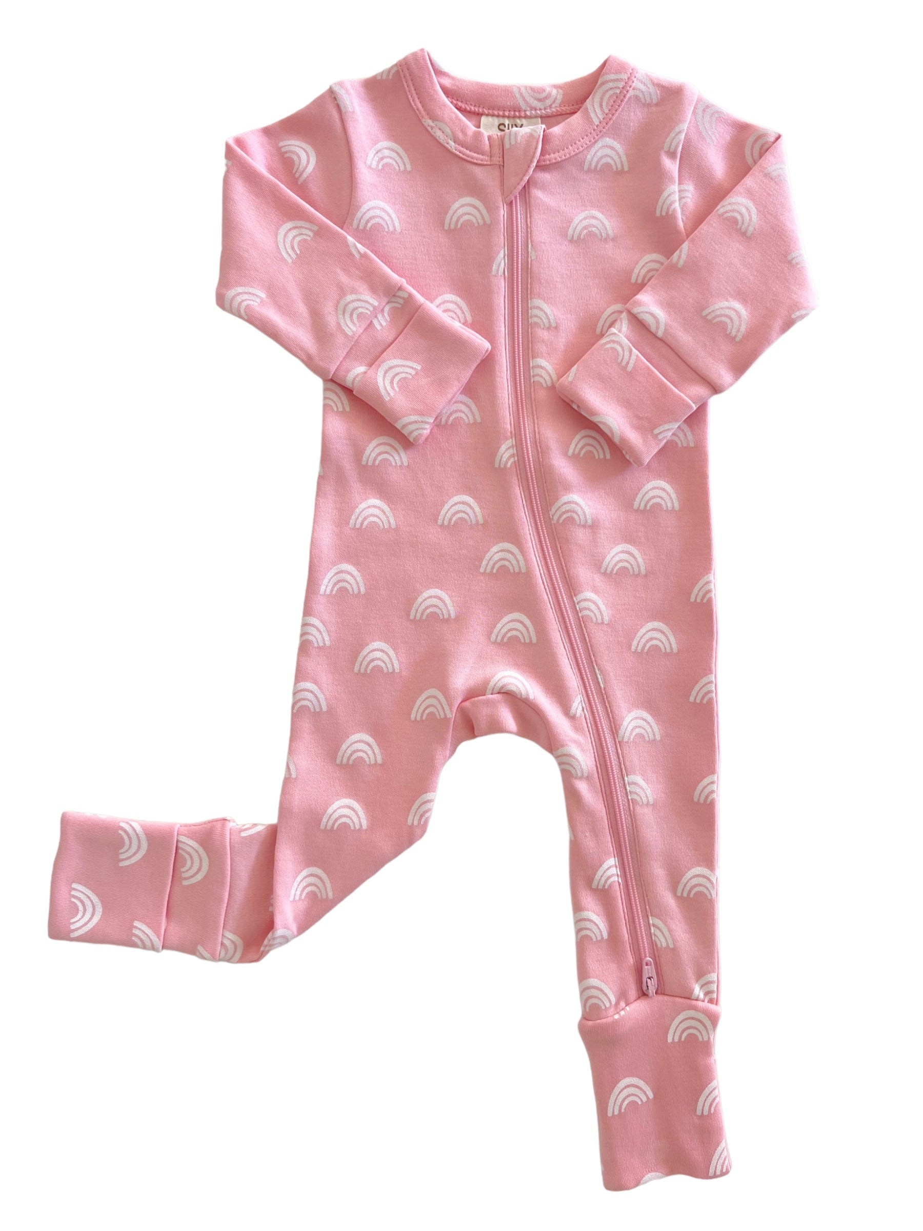 Pink baby onesie covered in white rainbow patterns, featuring a front zipper and cuffed sleeves and ankles.