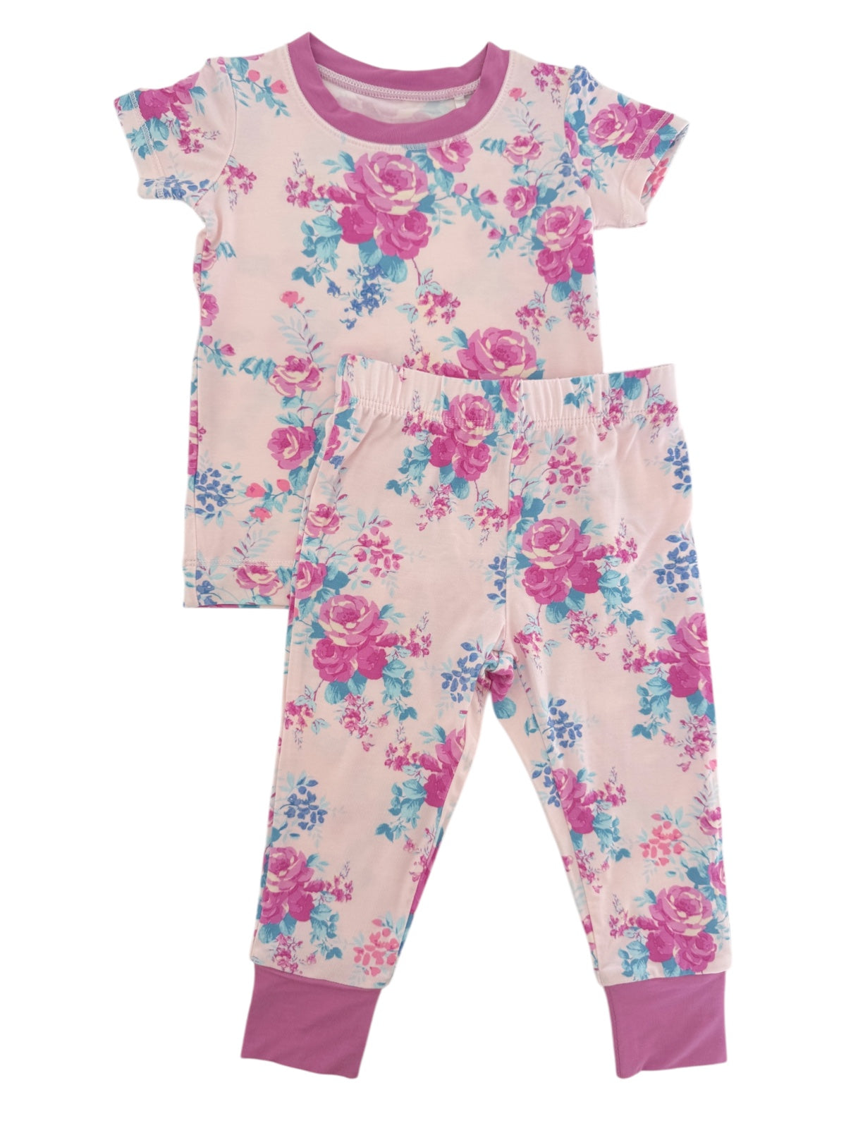 Floral pattern children's pajamas set with pink and blue flowers on a light background. Short-sleeve top and leggings.