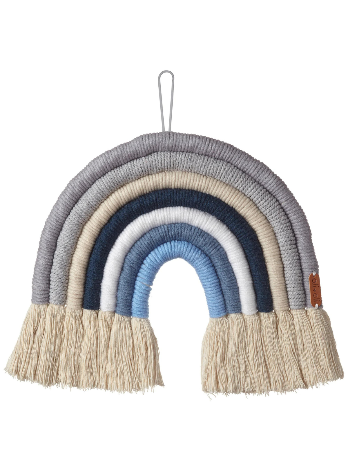 Woven rainbow wall hanging in shades of gray, blue, and cream with fringe details.