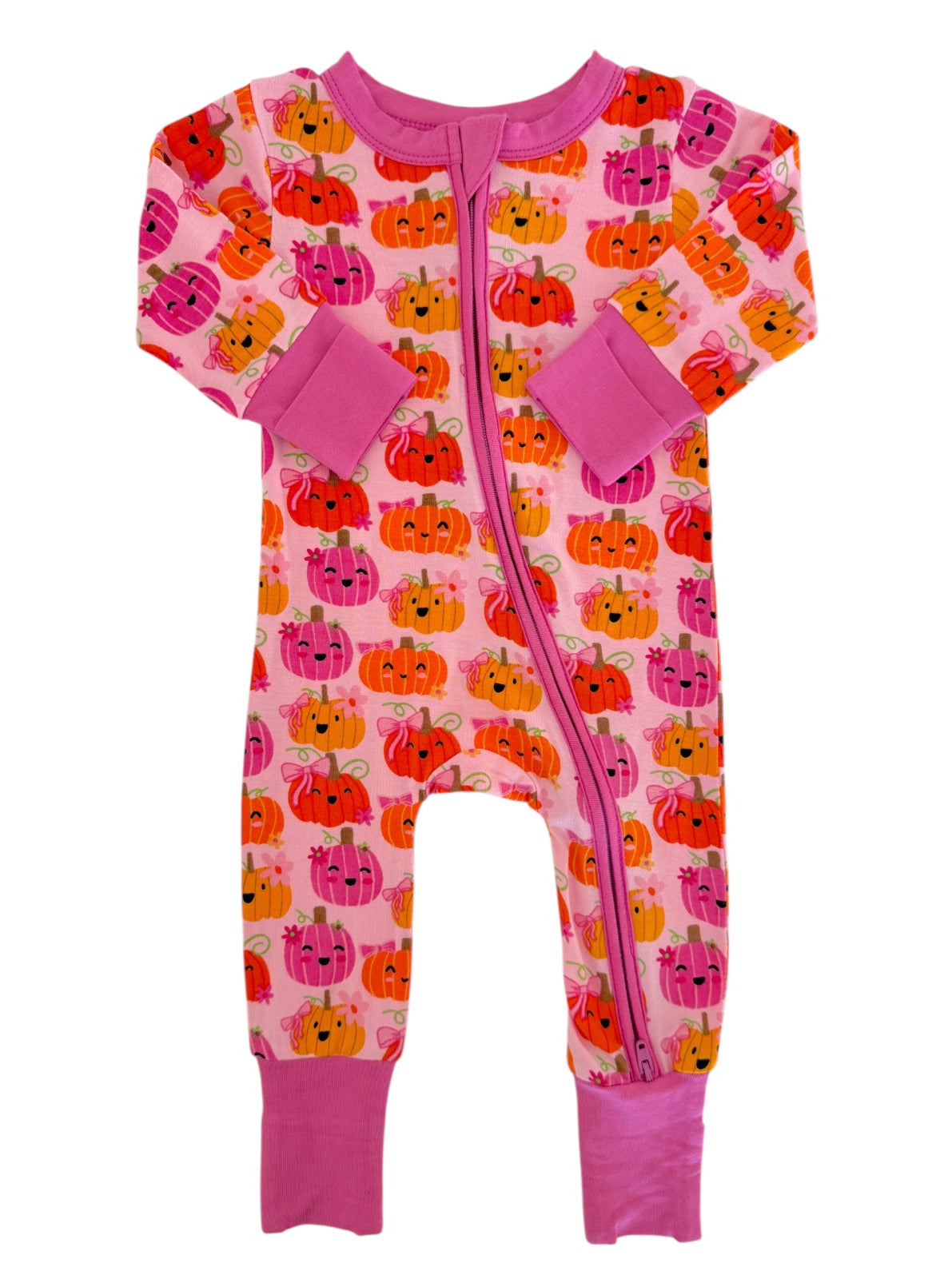 Children's pink onesie with playful pumpkin print, featuring long sleeves and a zipper closure.