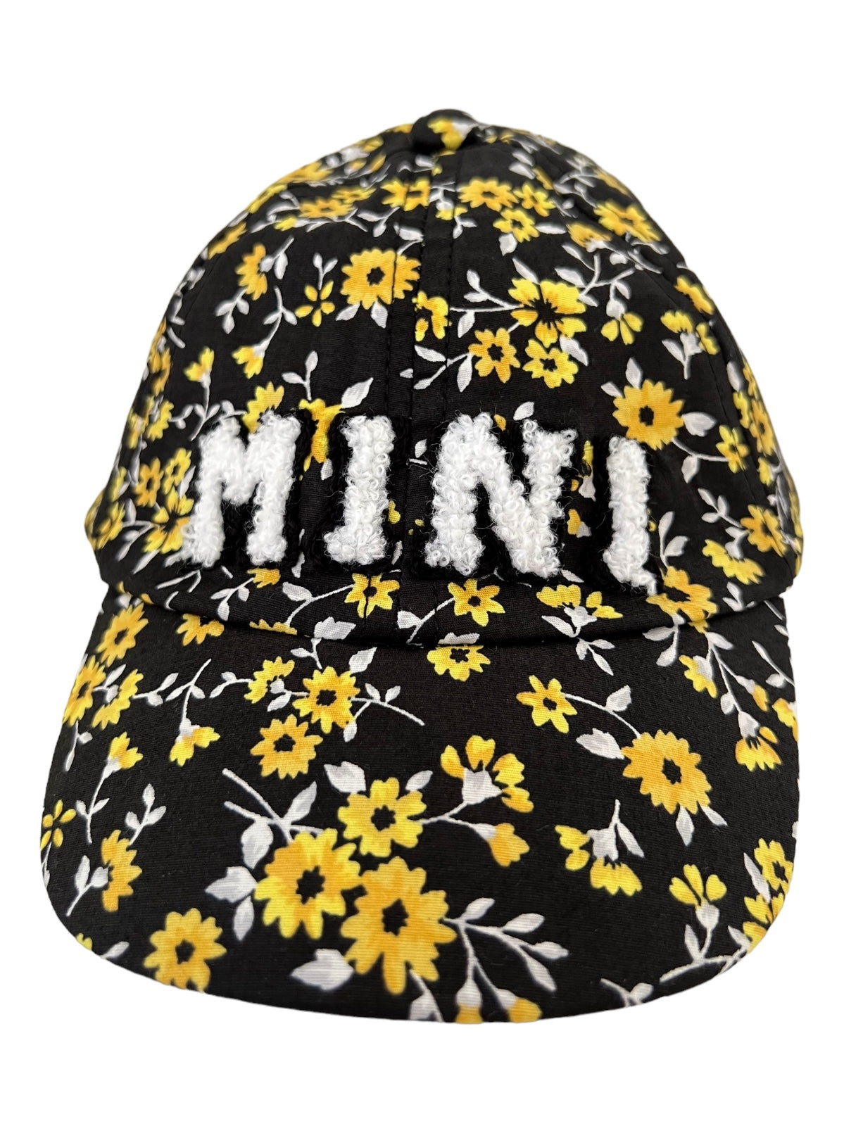 Floral black cap with yellow flowers and the word "MINI" in fuzzy white lettering on the front.