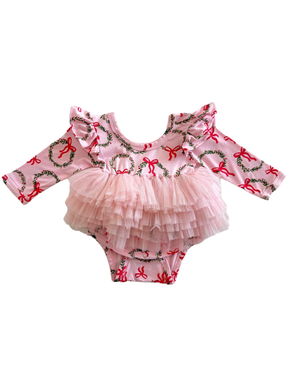 Pink long-sleeve onesie with festive bow print and a layered tulle skirt for infants.