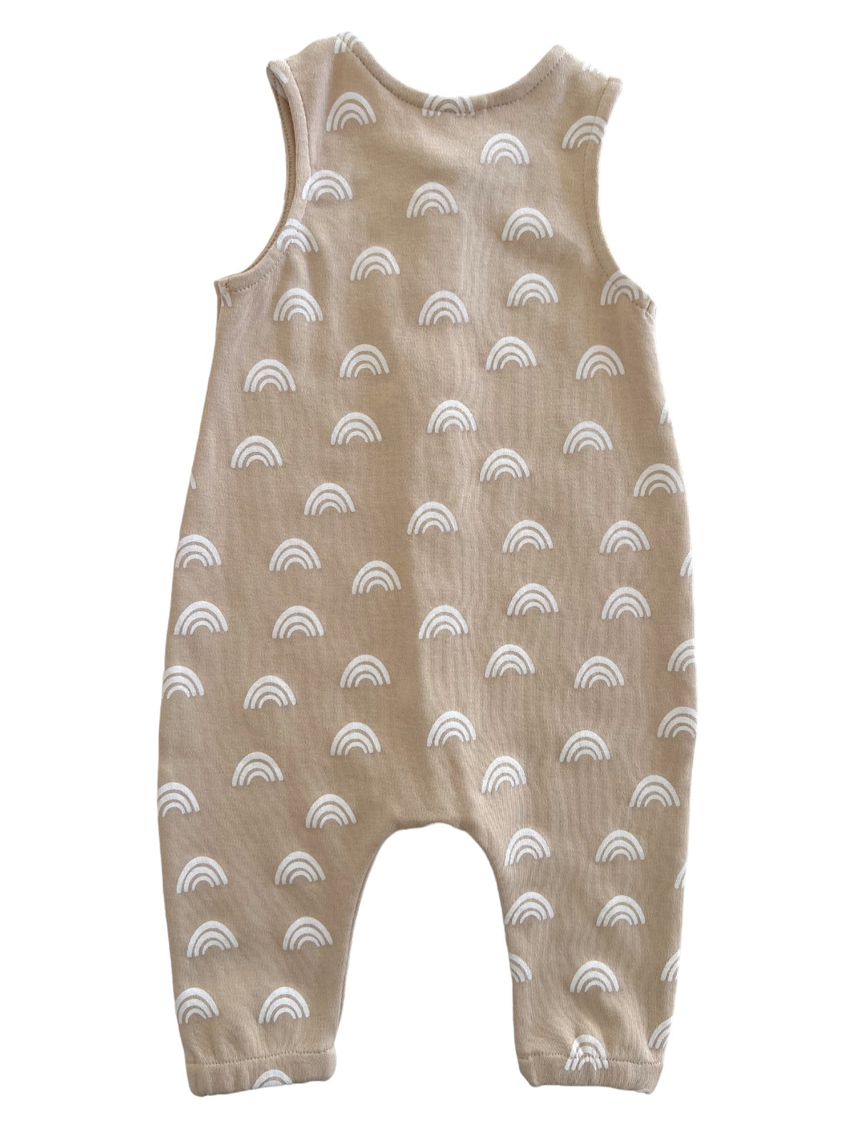 Beige baby romper featuring white rainbow patterns, sleeveless design, and relaxed fit. Ideal for comfortable wear.