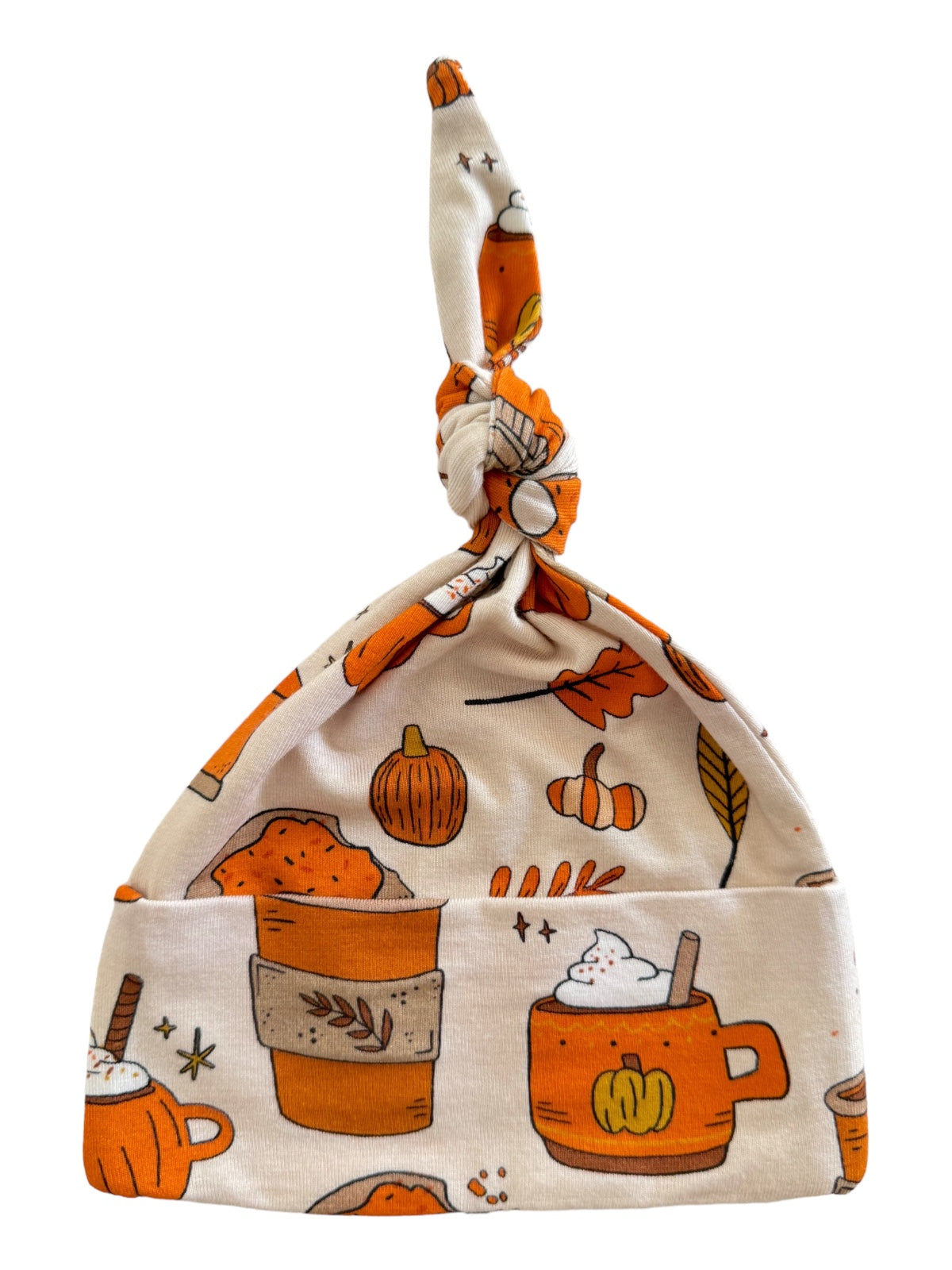 Knotted baby hat with autumn-themed patterns, featuring pumpkins and coffee cups in warm colors.