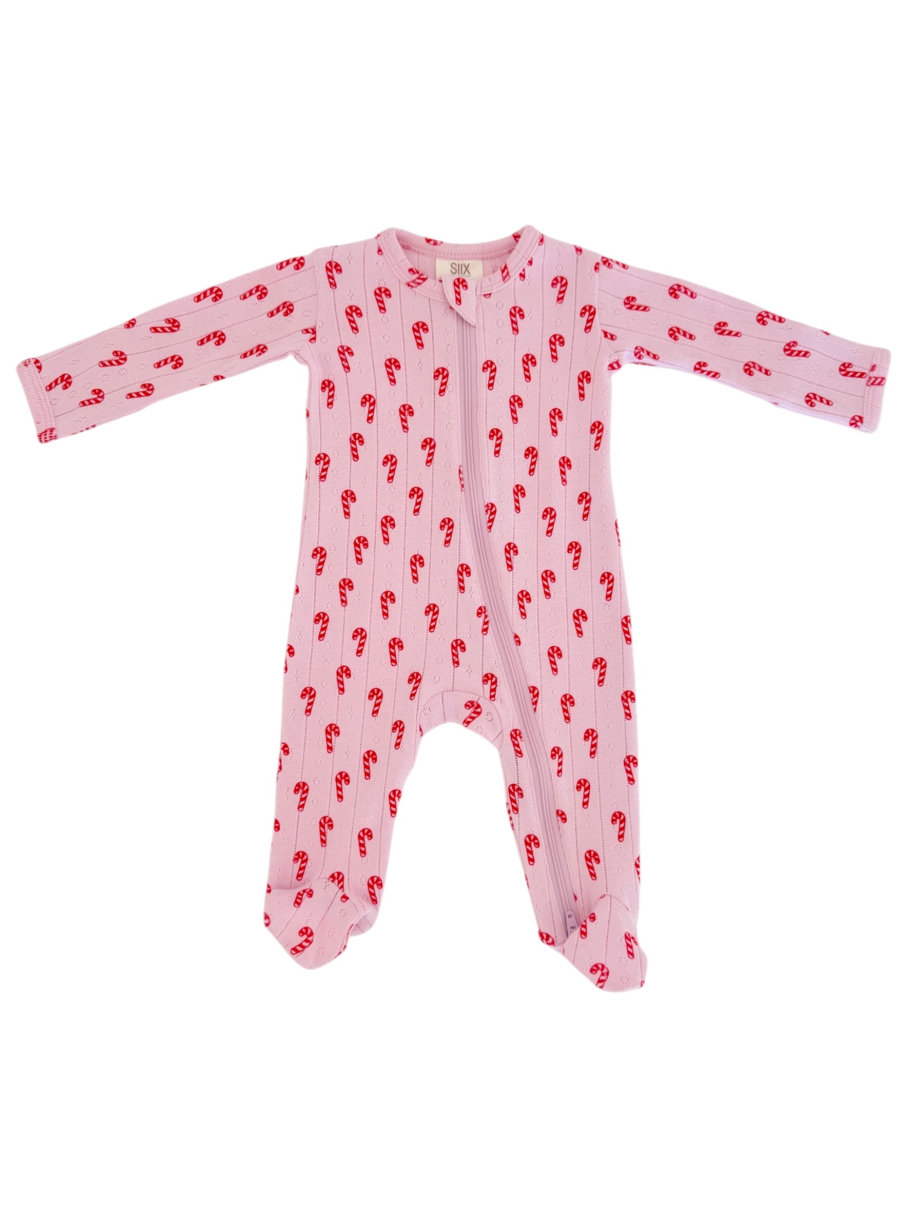 Pink baby onesie with red candy cane pattern, featuring long sleeves and a front zipper.
