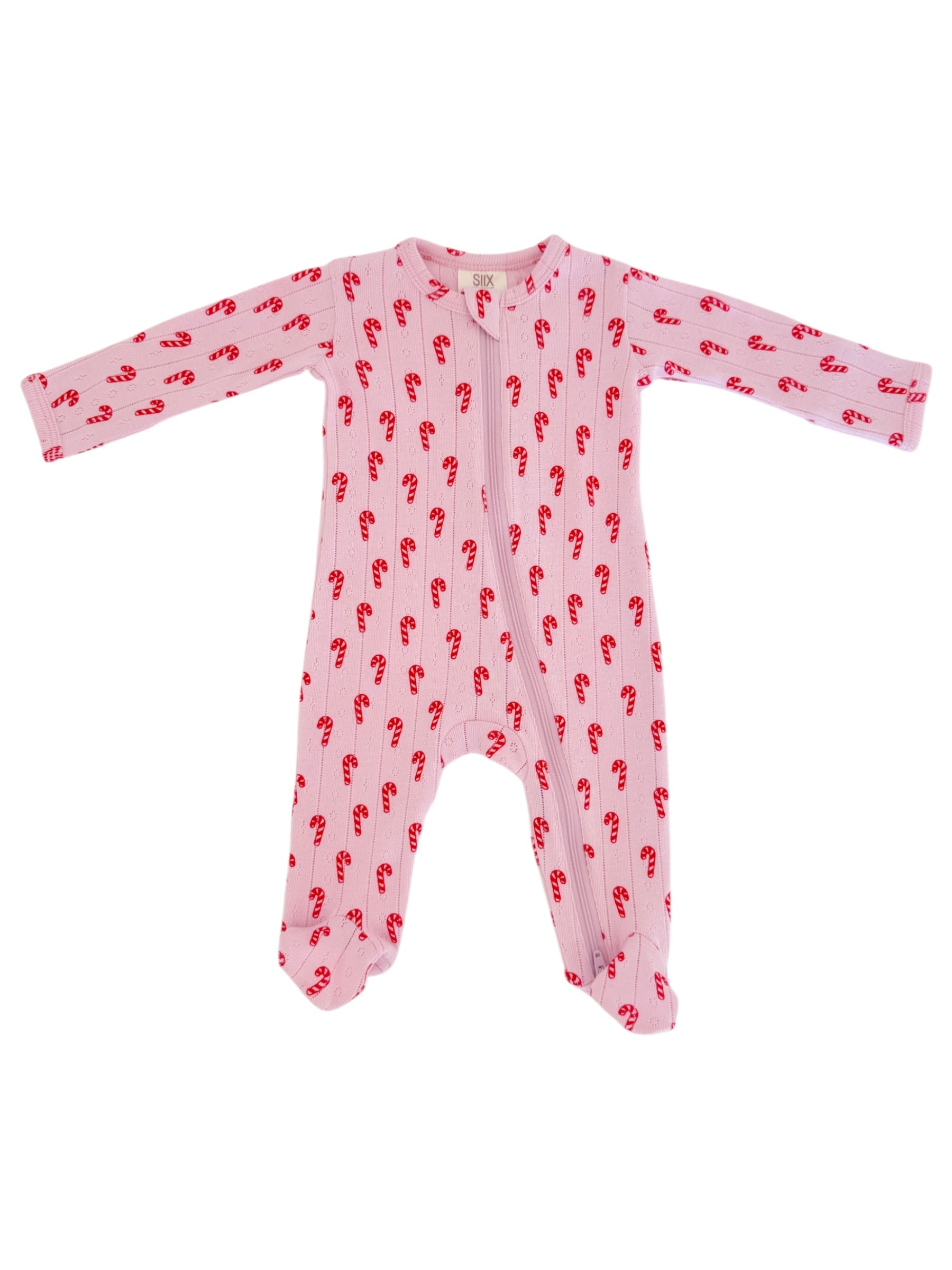 Pink baby onesie with red candy cane pattern, featuring long sleeves and a front zipper.