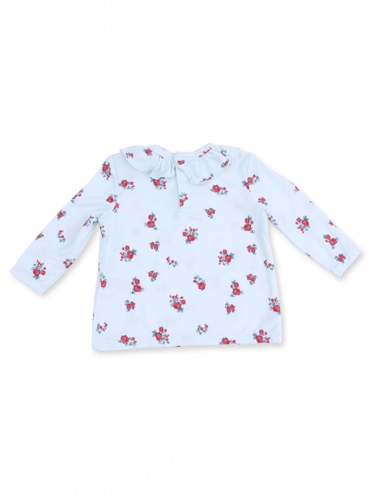 Long-sleeve children's shirt in light blue with a floral pattern and ruffled collar detail.