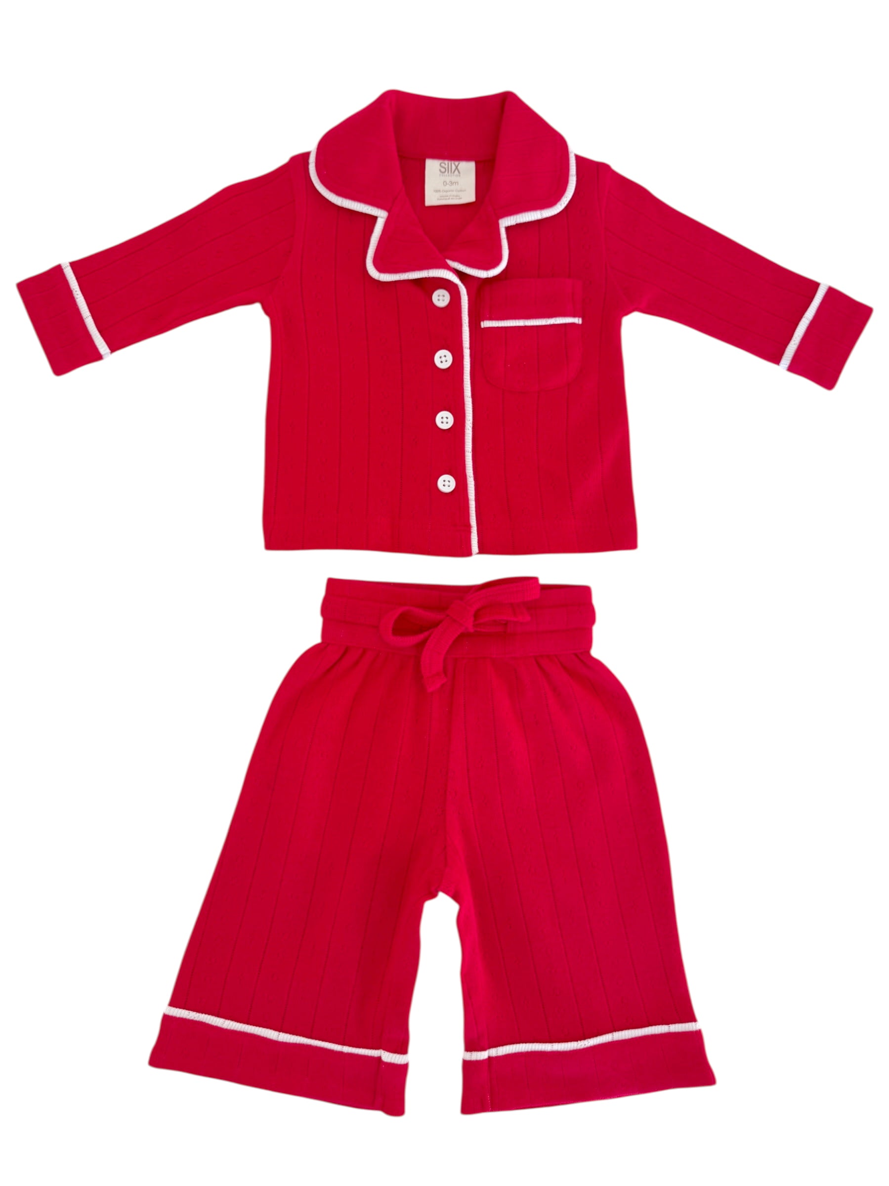 Red kids’ pajamas set with a collared button-up top and matching shorts, featuring white trim and vertical stripes.