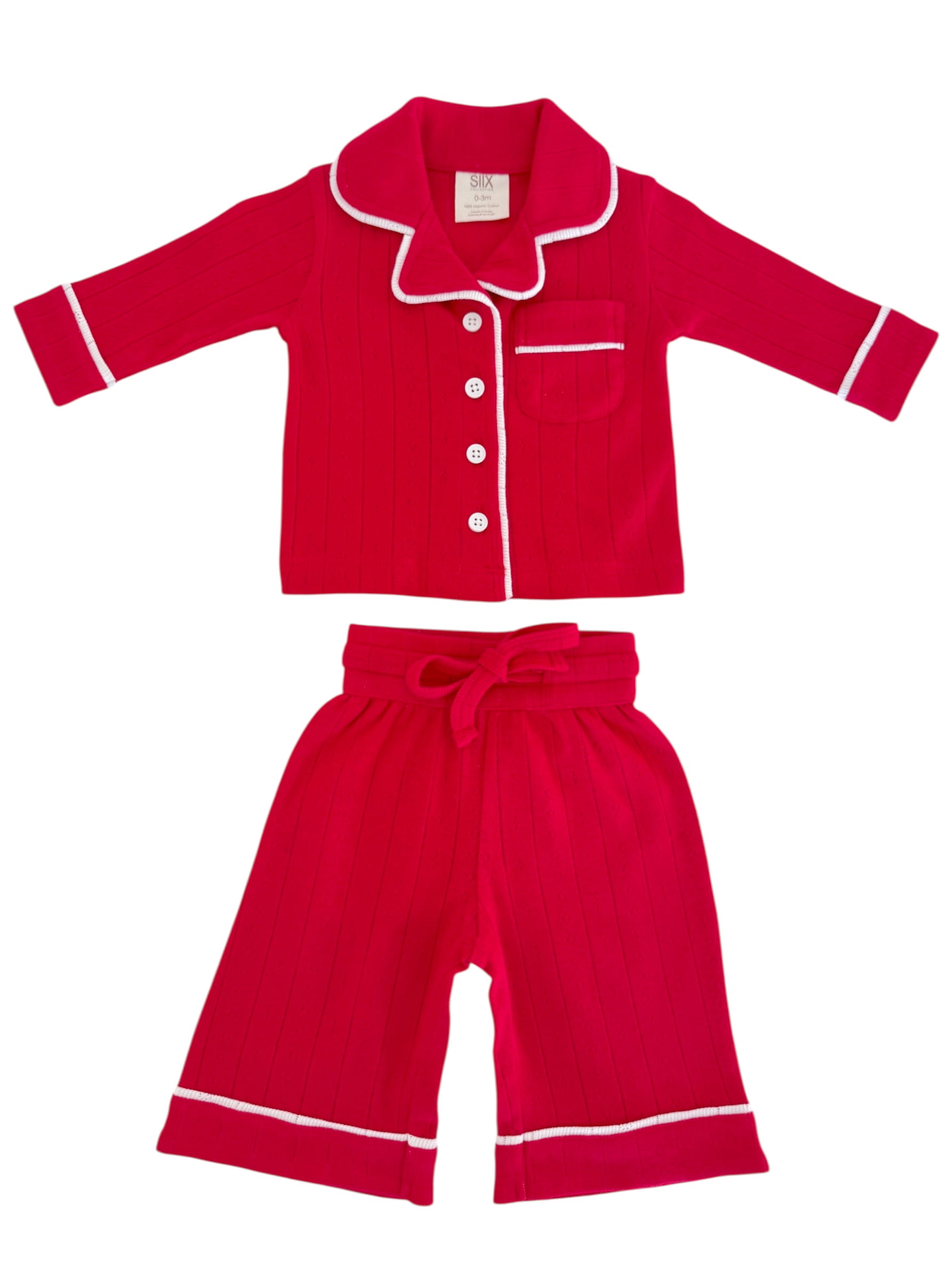 Red kids’ pajamas set with a collared button-up top and matching shorts, featuring white trim and vertical stripes.