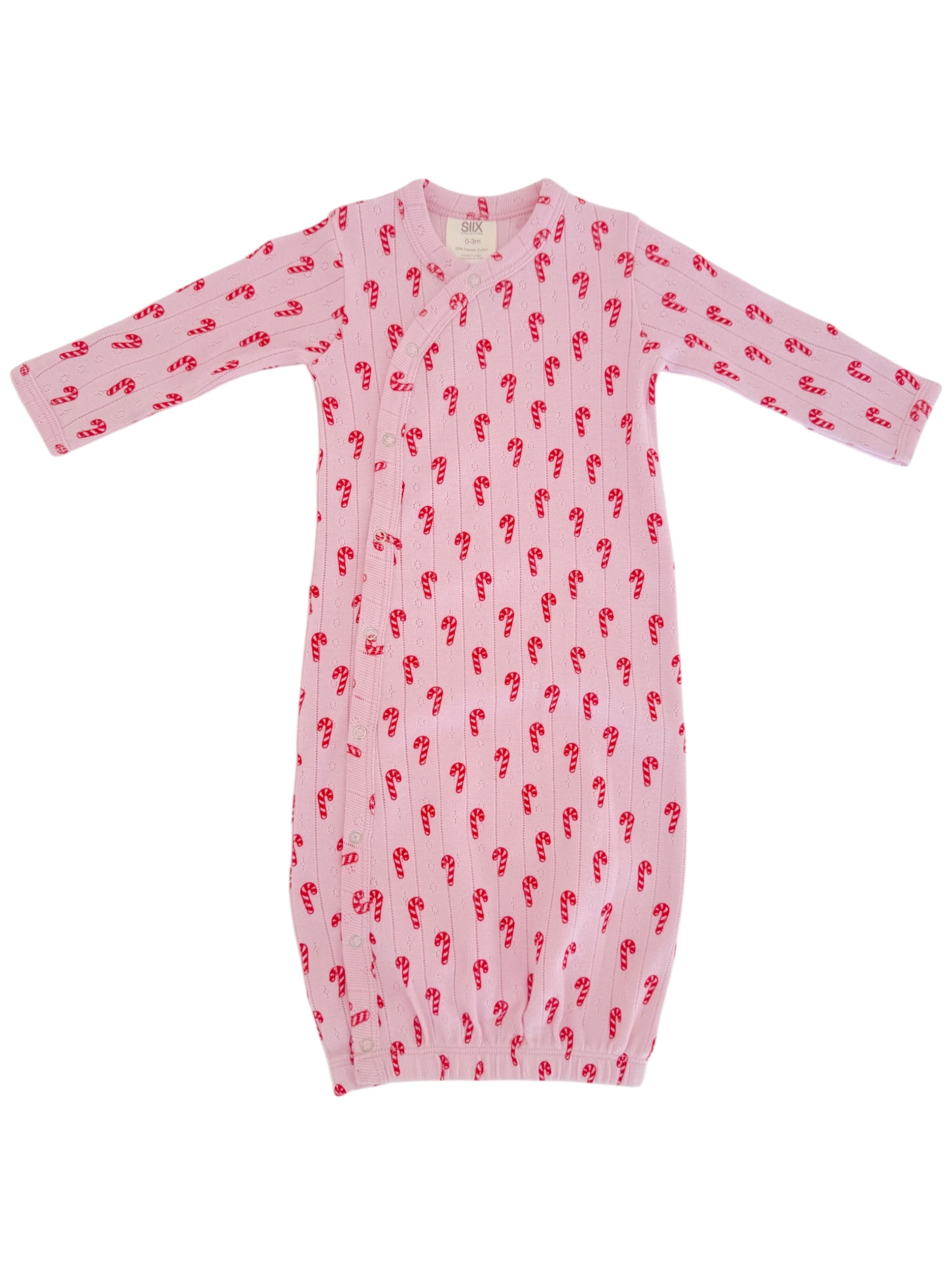 Pink baby gown with candy cane pattern and long sleeves, featuring snap buttons for easy dressing.