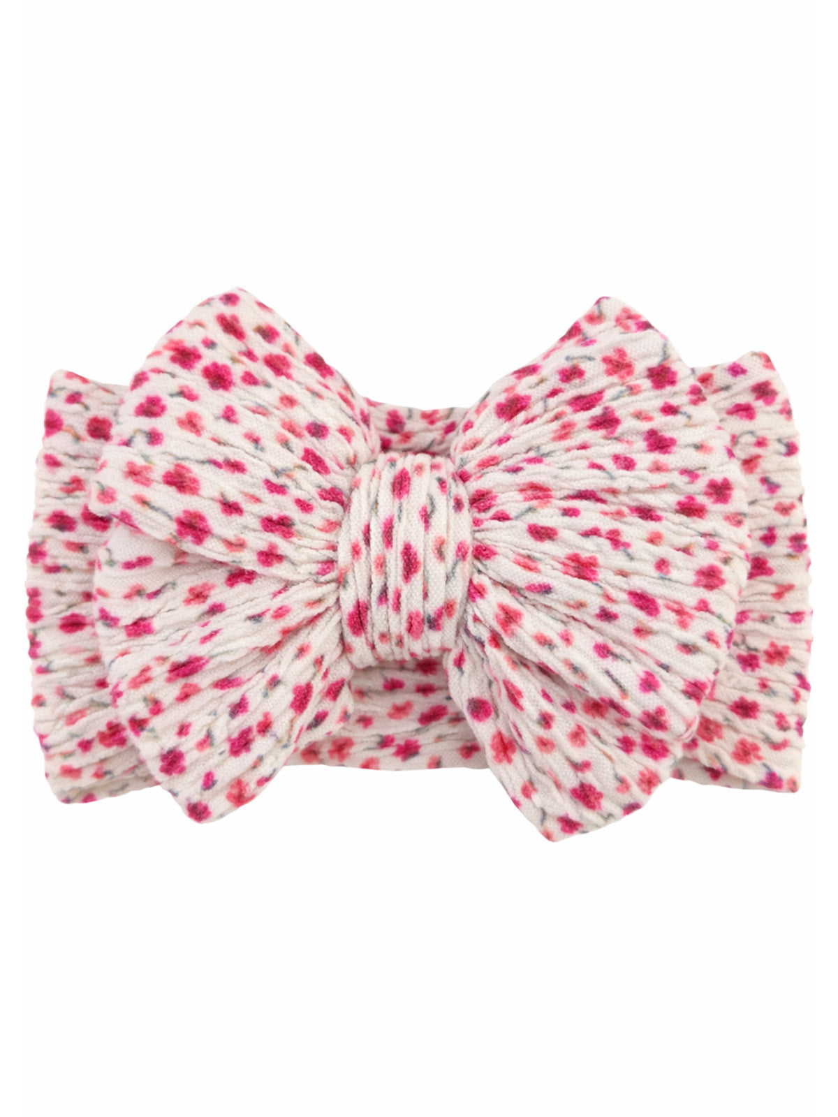 Pink and white polka dot bow hair accessory with a textured design.