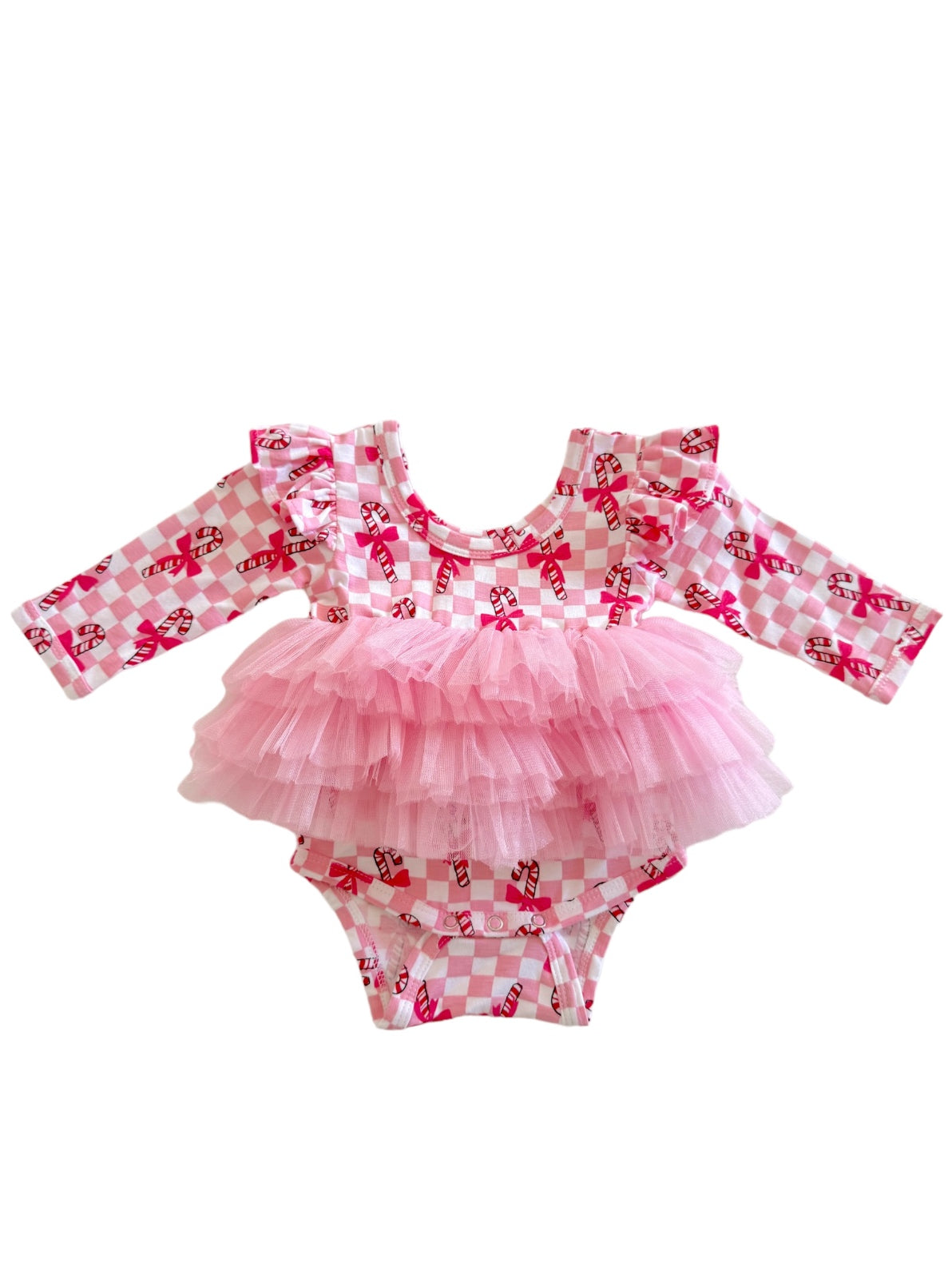 Pink diaper cover with ruffled sleeves and a tulle overlay, featuring a candy cane print on a checkered background.