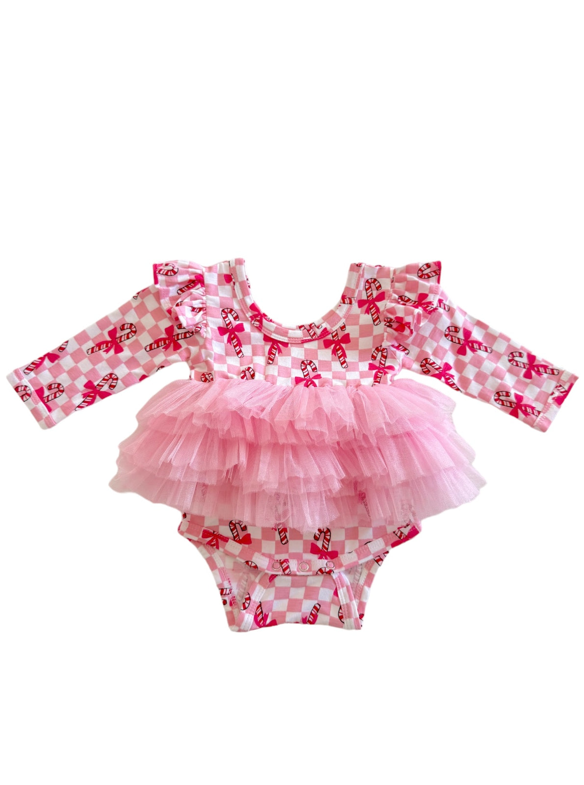 Pink diaper cover with ruffled sleeves and a tulle overlay, featuring a candy cane print on a checkered background.