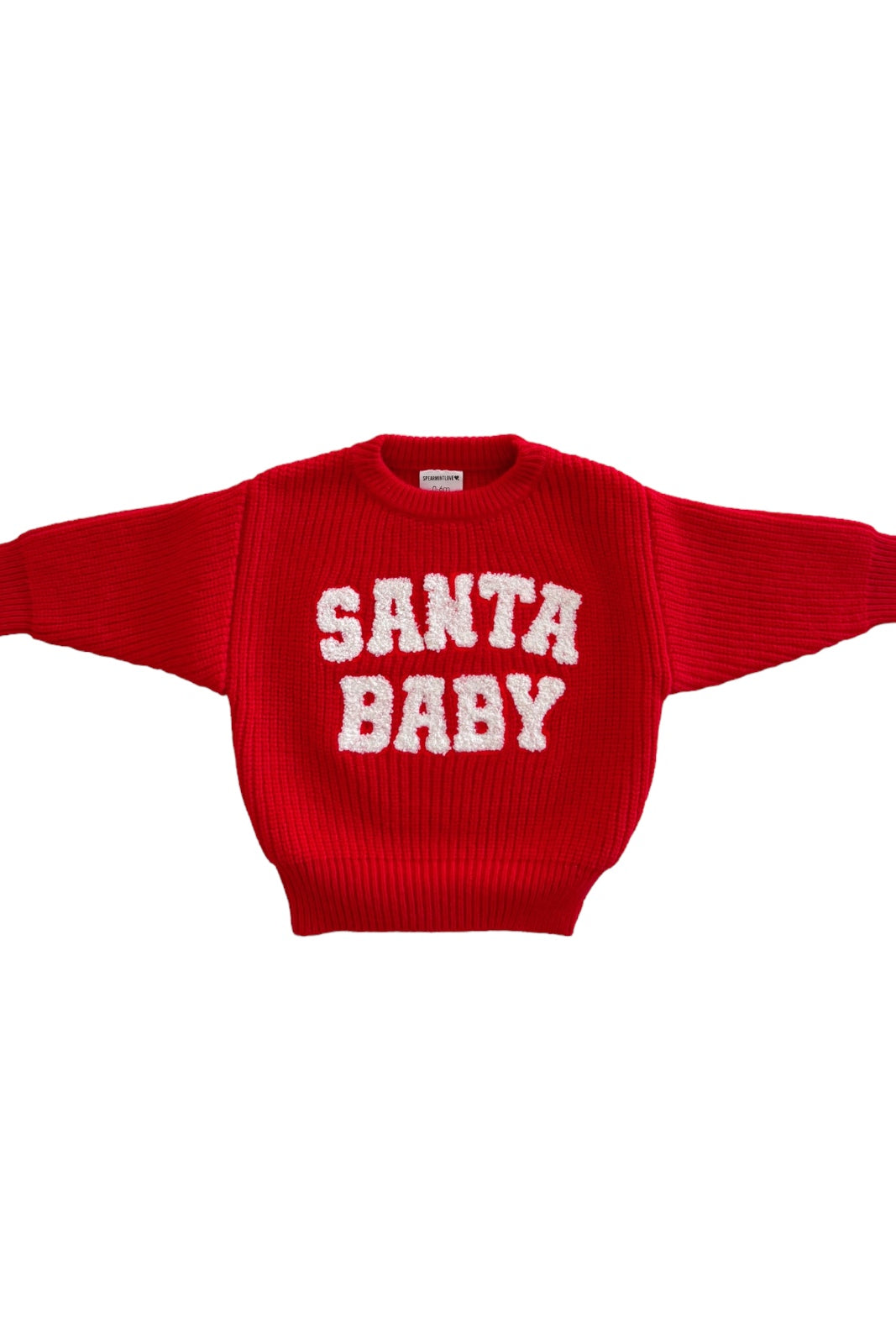 Red sweater with the text "SANTA BABY" in white, featuring a ribbed texture and oversized sleeves.